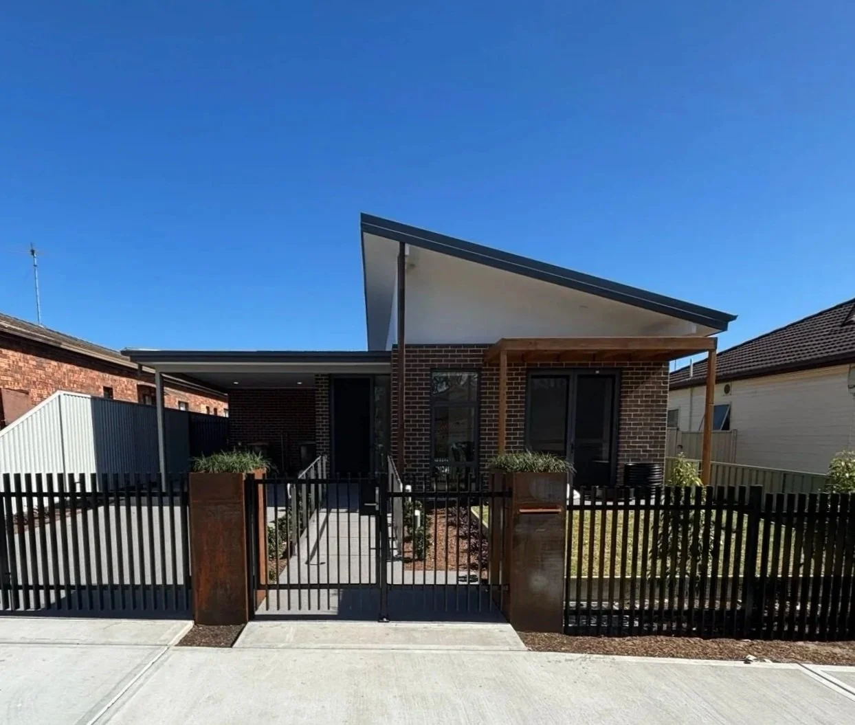 Image of a group home in roserbery with bricks and landscaped fenced garden
