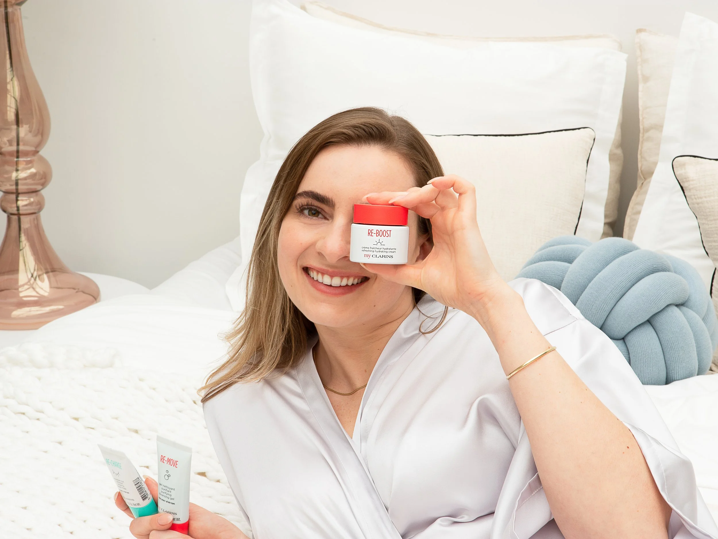 Clarins skincare product photography with model