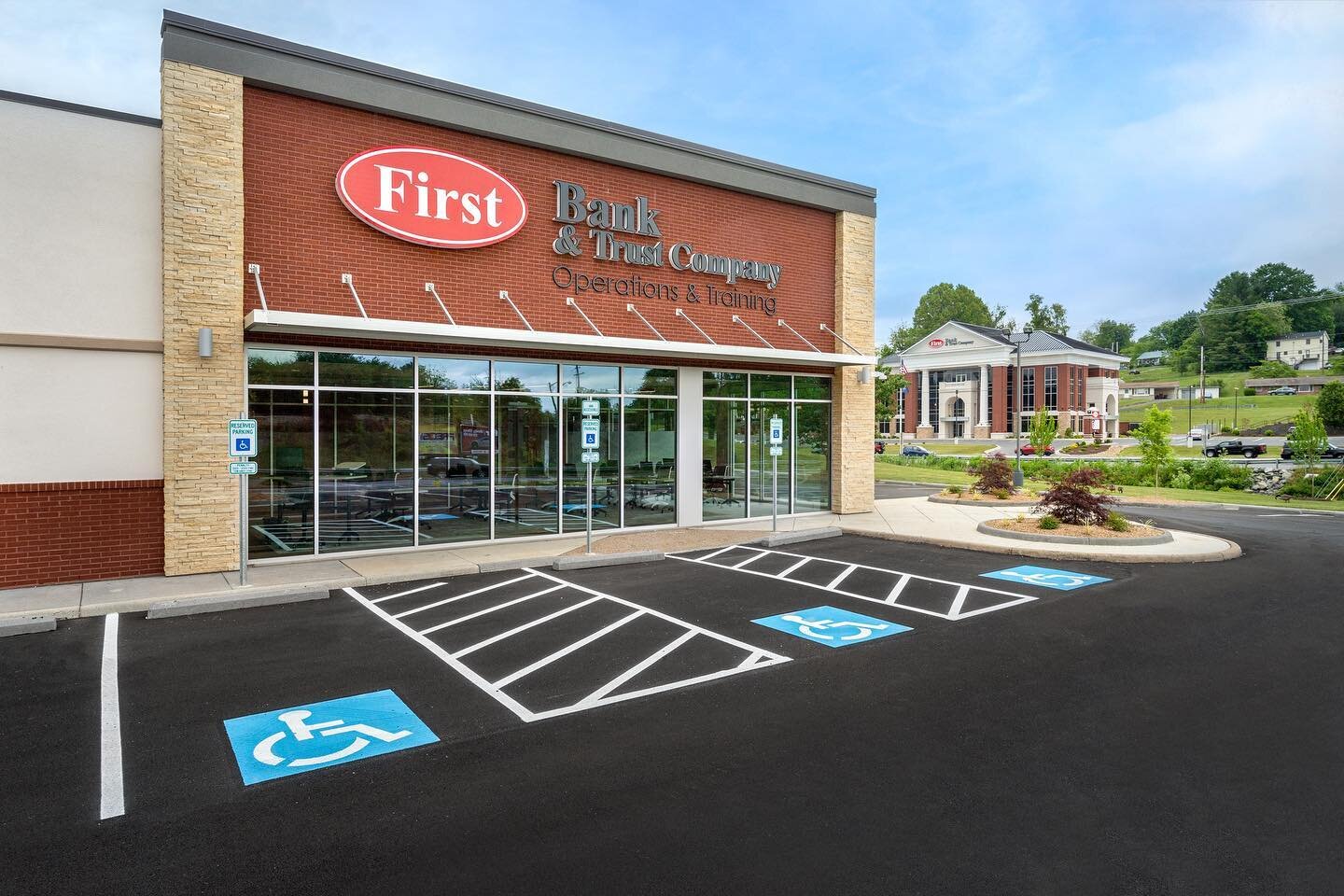 This operations center is an adaptive re-use of an existing Rite Aid into an 11,000 SF office space that will provide new operations support for First Bank &amp; Trust. A focus was put on efficiently re-using existing infrastructure while providing a