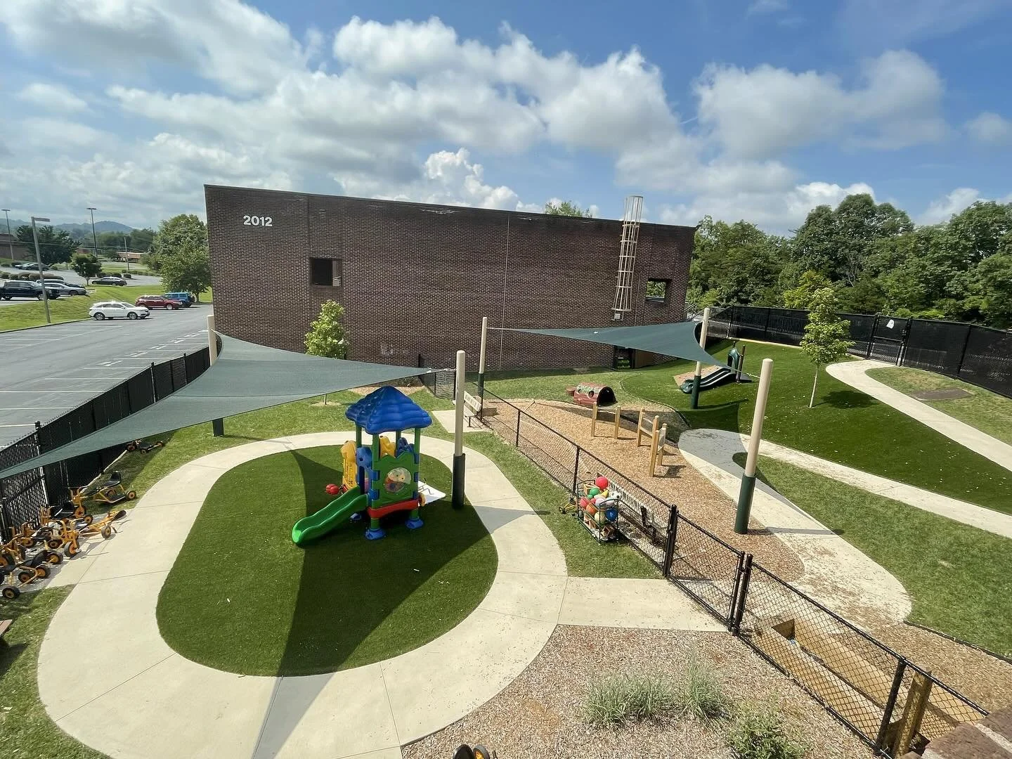 What a glow-up! ☀️check out the spectacular before &amp; after of the Ballad Health Center for Early Learning in Kingsport. This new playground gives students plenty of space to run, ride their trikes, and explore their surroundings. Plus, the sun sh