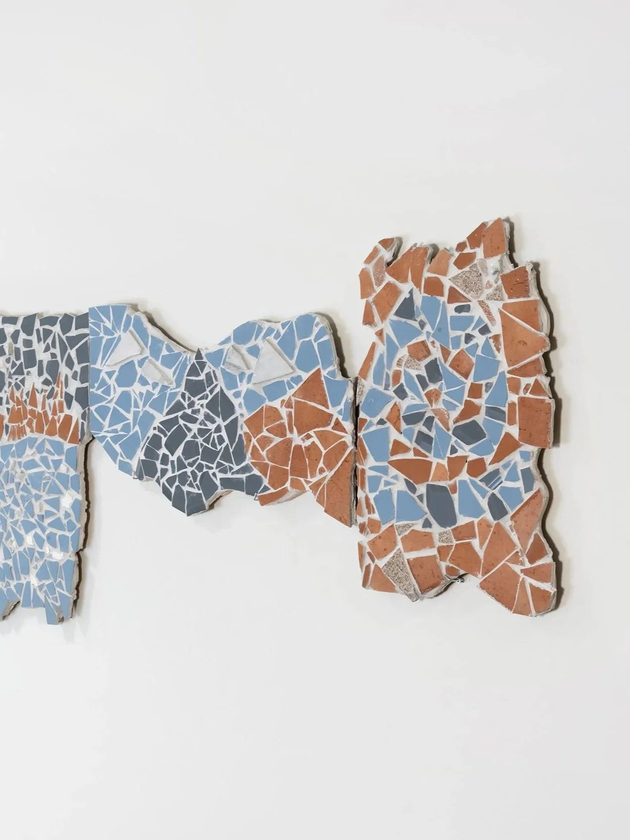 Broken mosaic art on a white background.