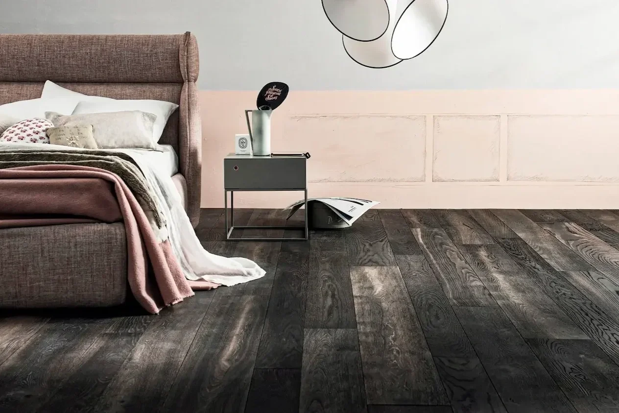Engineered wood flooring providing a natural aesthetic for bedroom interiors.