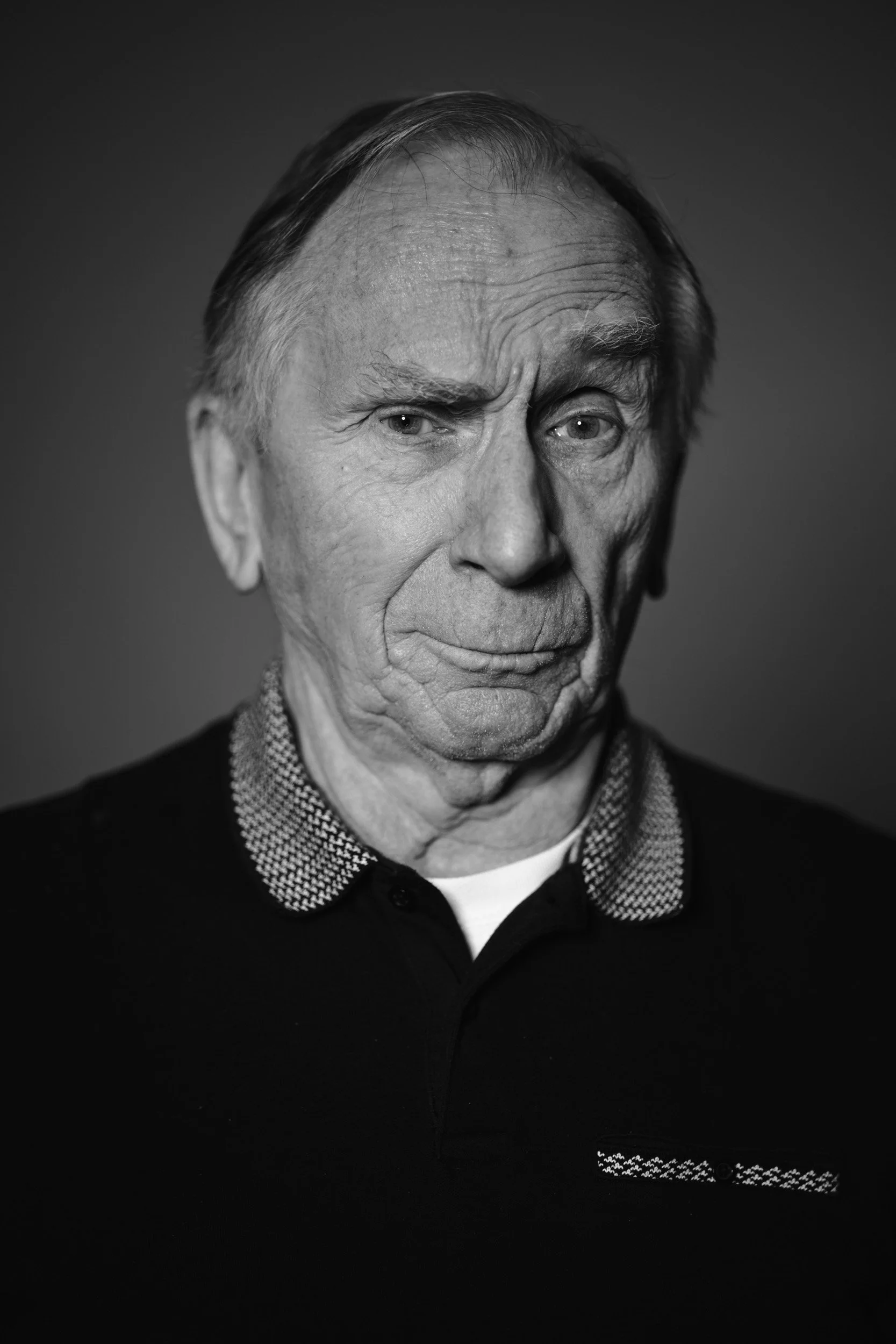 portrait_of_mature_man_raing_eyebrow_comically.jpg