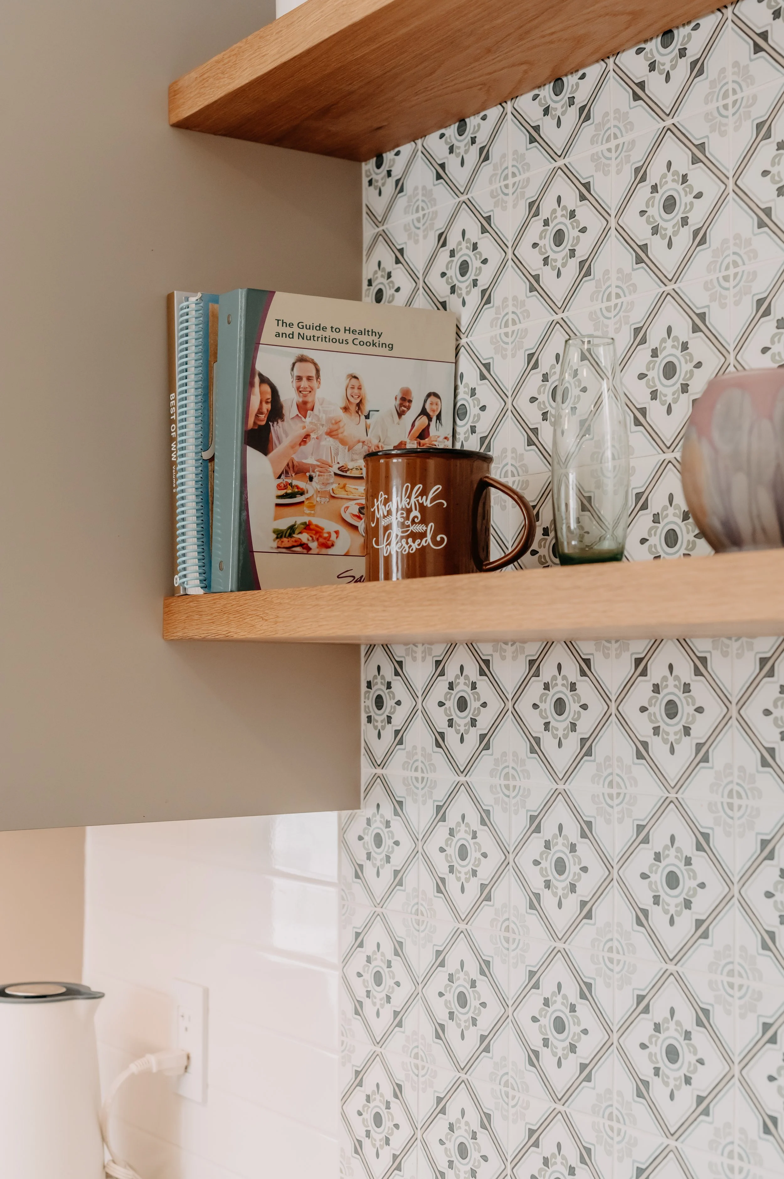Wood shelve, cooking plate, patterned backsplash