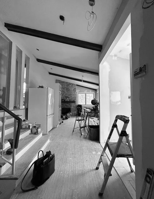 Existing layout with exposed beam ceiling, prior to the custom blue kitchen redesign.