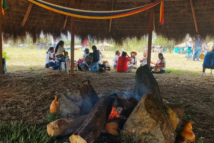 indigenous people seated near fire