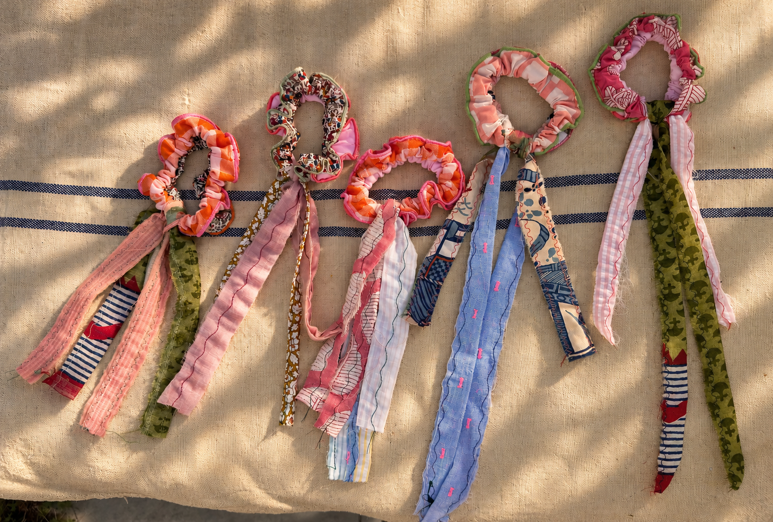 Sunlit Handmade Scrunchies on Linen.png