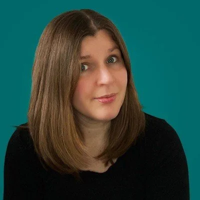 Picture of professional translator, Bethan Thomas, against a teal background.