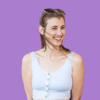 Picture of professional translator, Julia Ferch, against a purple background.