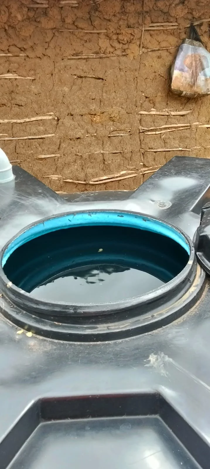 Water tank full of rain water.jpg