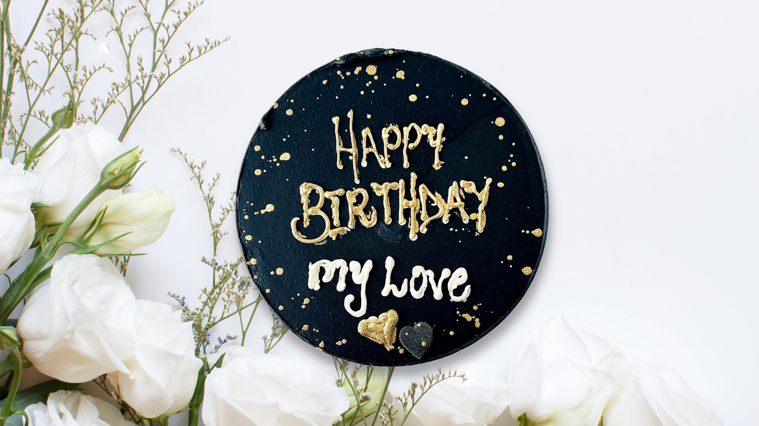 Simple Black Mini Cake by Sensational Cakes and Desserts adorned with gold splashes and a personalized message, delicately piped in gold and white buttercream