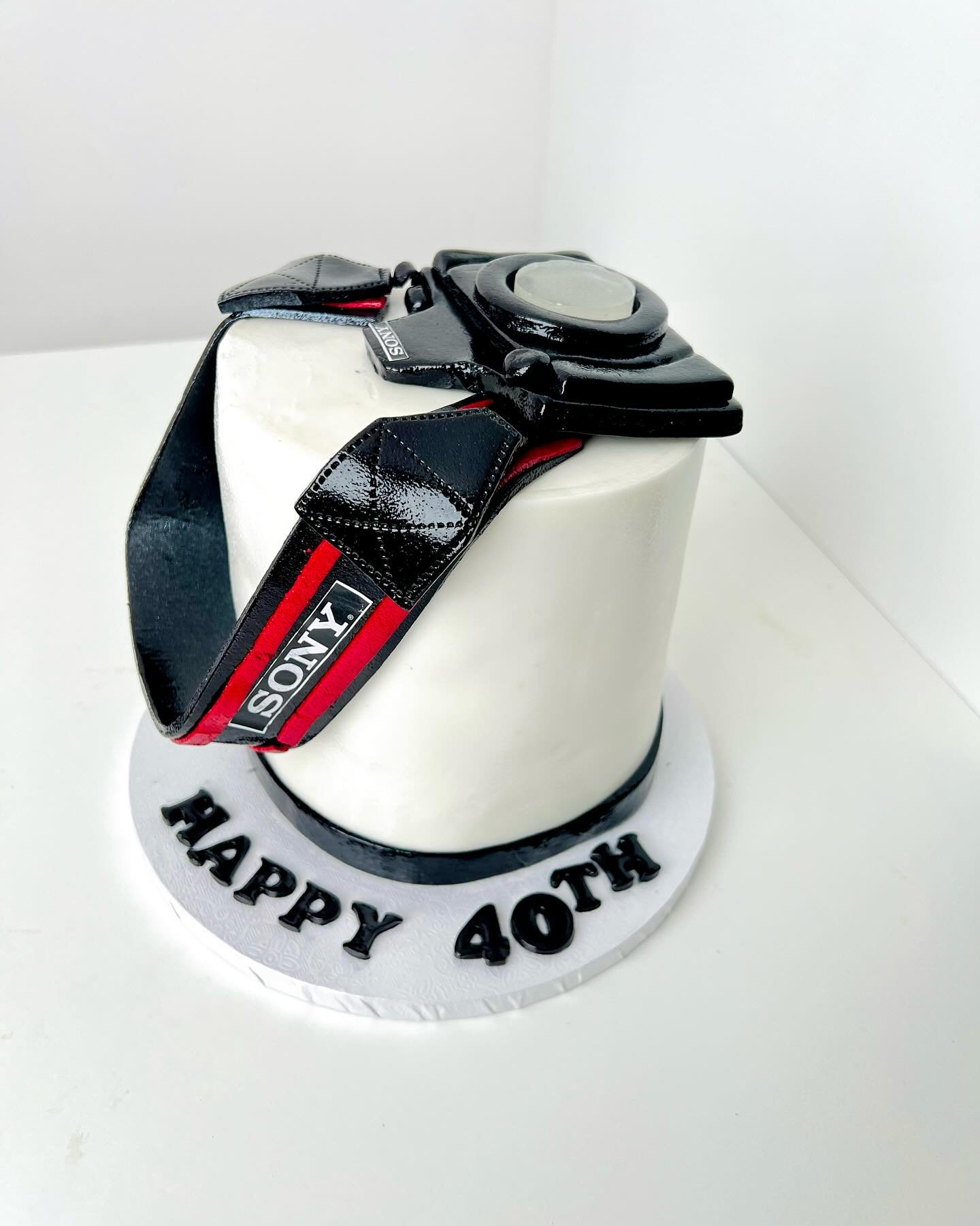 Mini Camera themed cake as requested by my client.
She wanted a small cake for her son that is a photographer.
She was particular about the type of camera and we came up with this.

The feedback was great and we are glad to have been a part of the ce