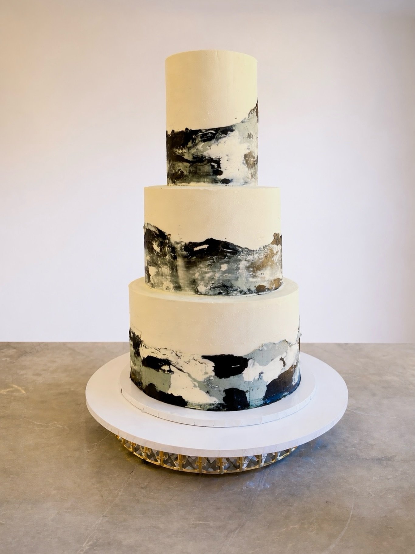 Black &amp; white&hellip; but make it luxury. 🖤🤍

A three-tier marbled masterpiece, finished entirely in rich chocolate ganache.

 Yes, even the marble design is pure ganache indulgence. Smooth, bold, and effortlessly elegant.

Want to deliver cake
