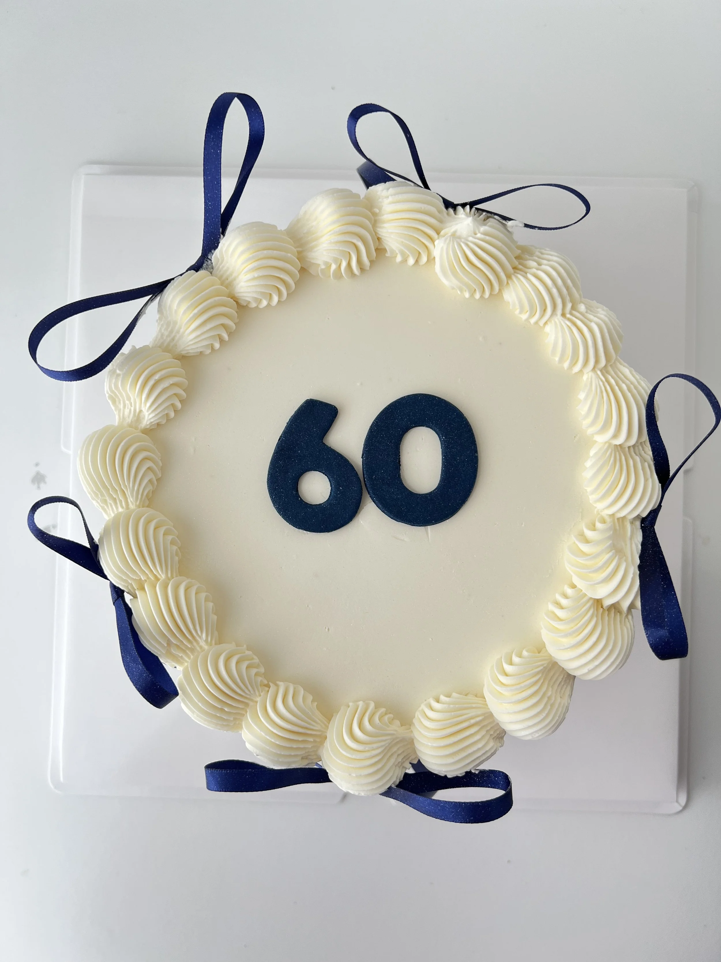 White Elegance Navy Blue Ribbon Cake by Sensational Cakes and Desserts