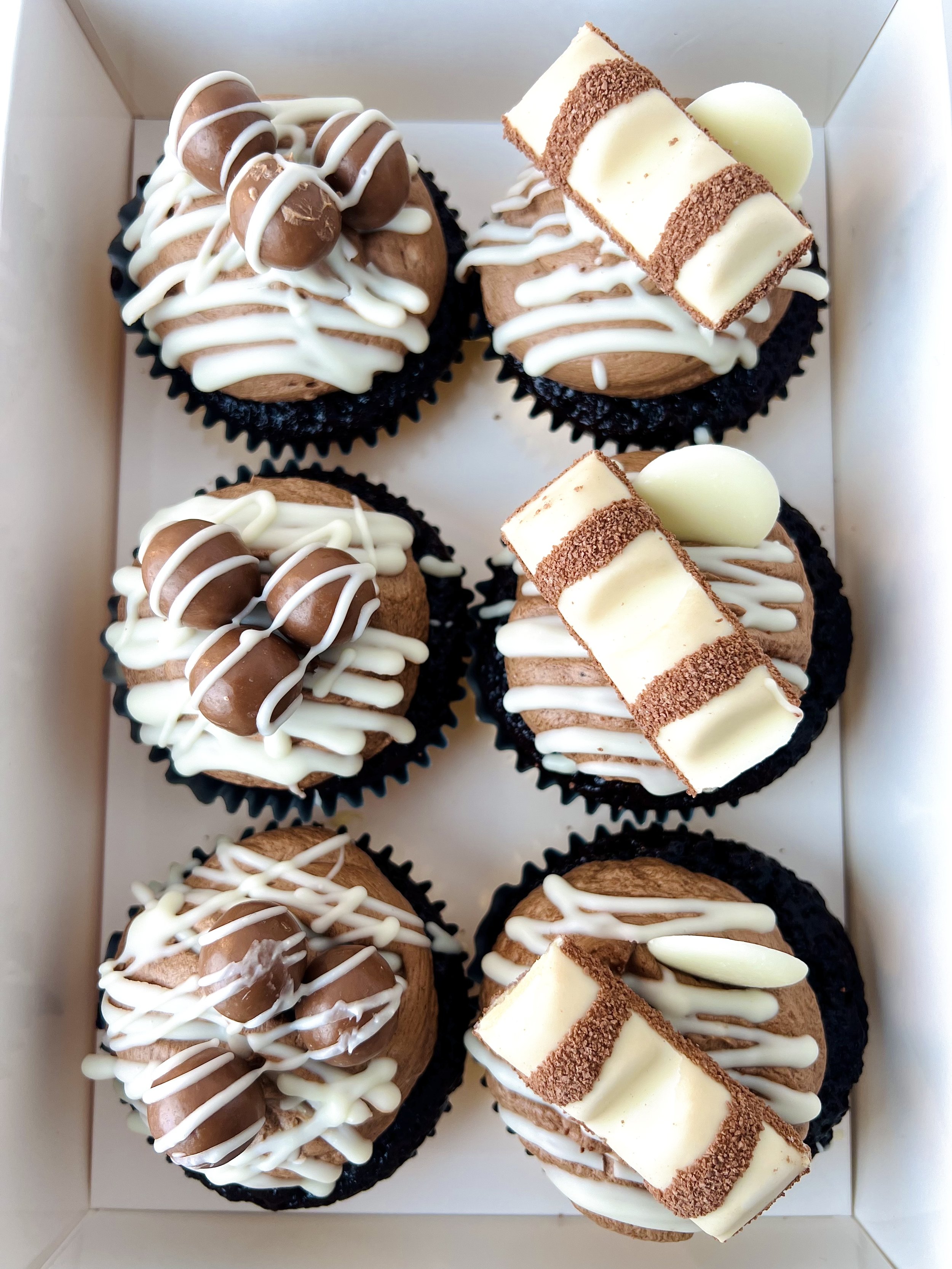 Chocolate Selection Cupcakes (Box of 6) by Sensational Cakes and Desserts topped with chocolate buttercream, Maltesers or Kinder Bueno