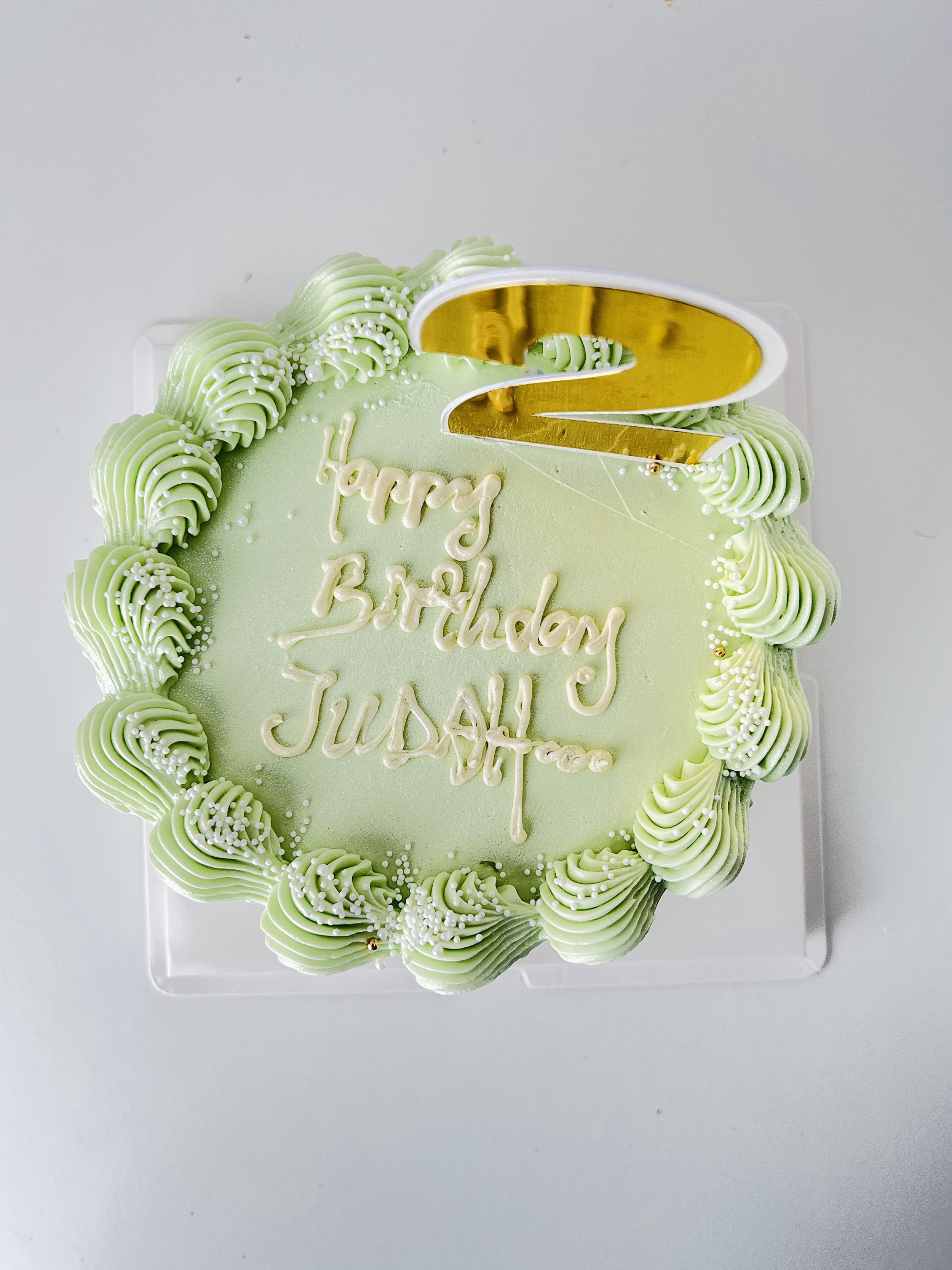Top view of the Top view of the Elegant Green Birthday Cake With Gold Number Topper by Sensational Cakes and Desserts