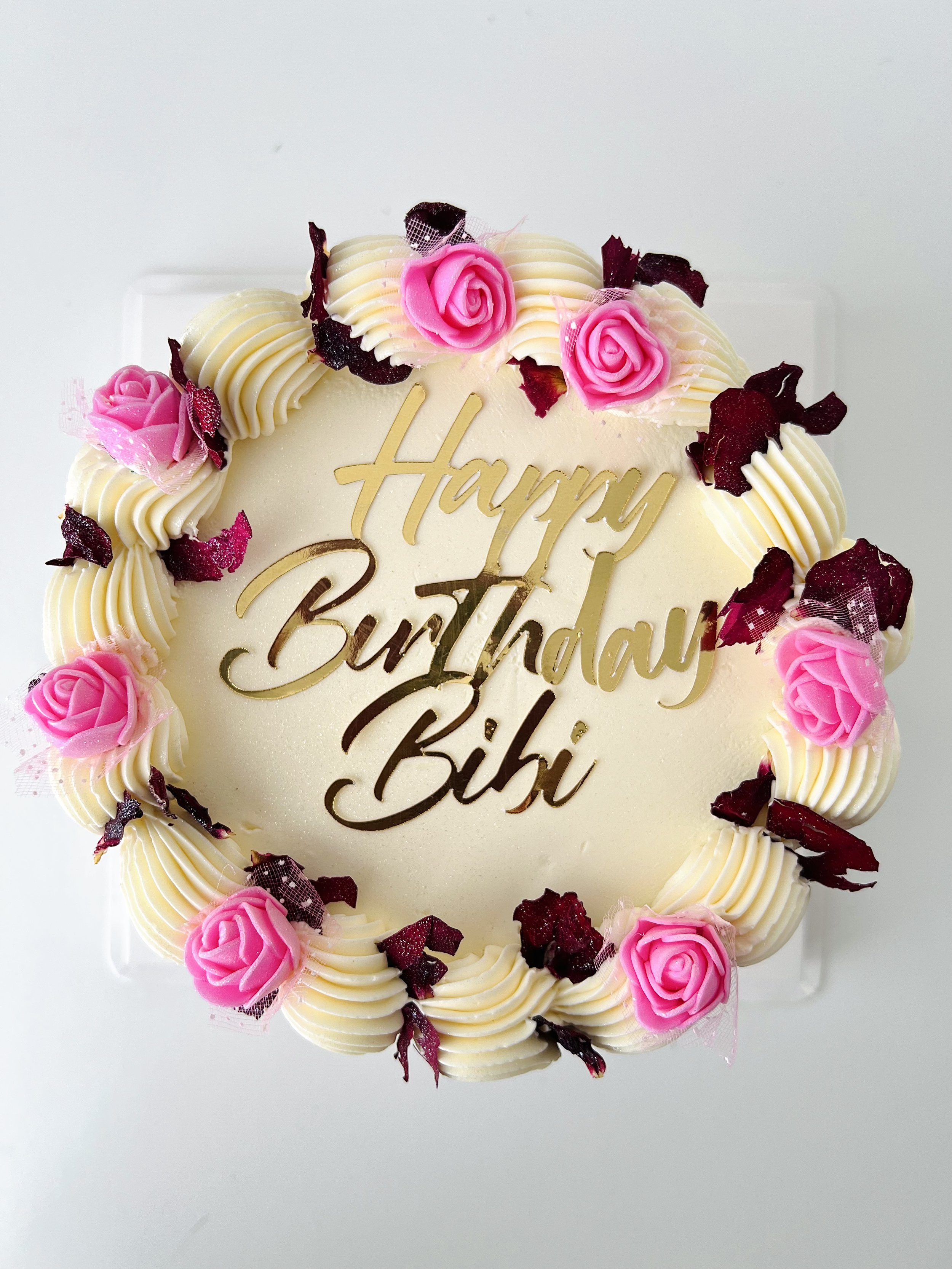 Top view of the Mini Cake With Edible Pink Floral Petals by Sensational Cakes and Desserts