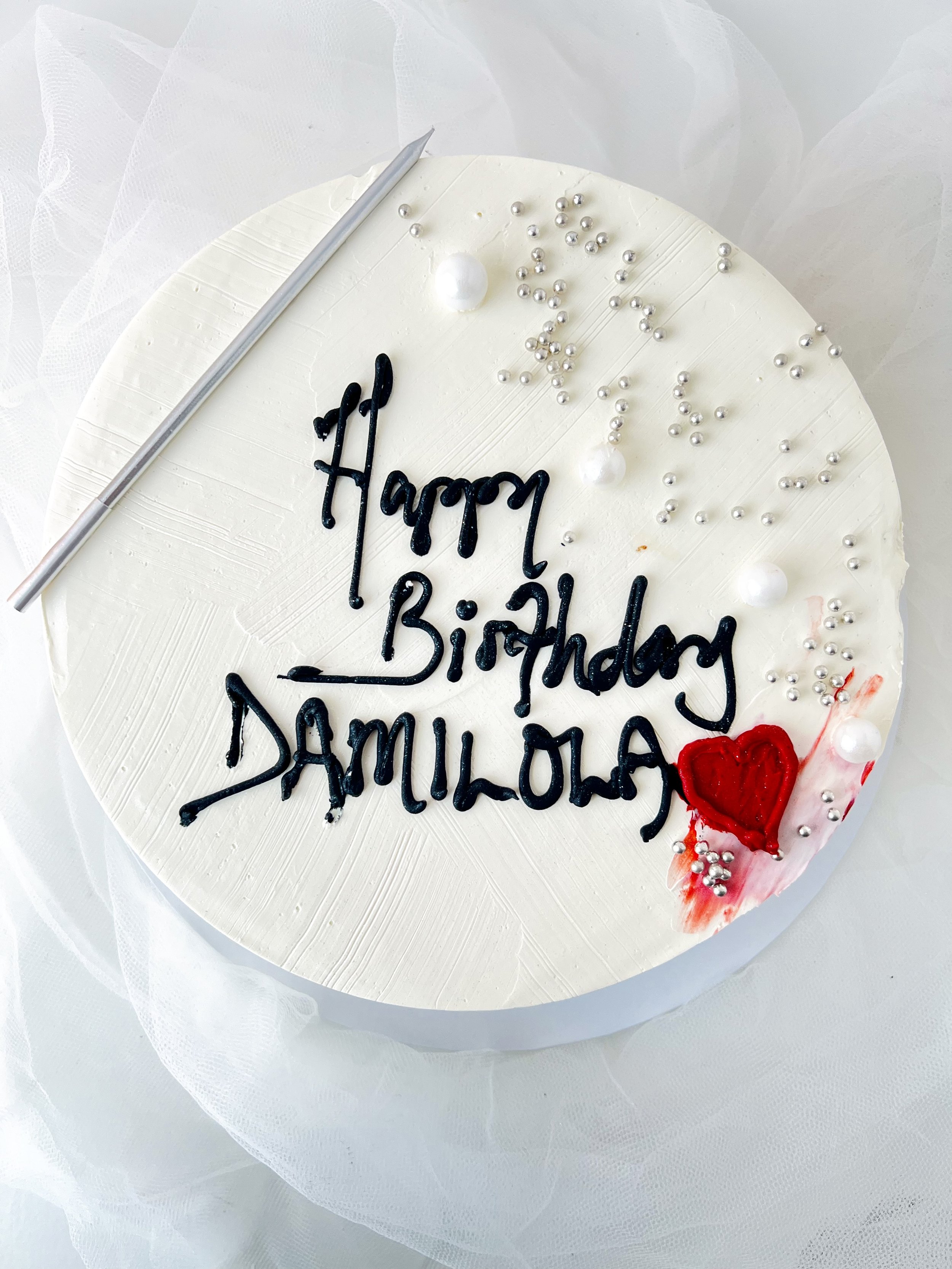 Top view of the Single Layer White Cake with Pearls and Candle by Sensational Cakes and Desserts.