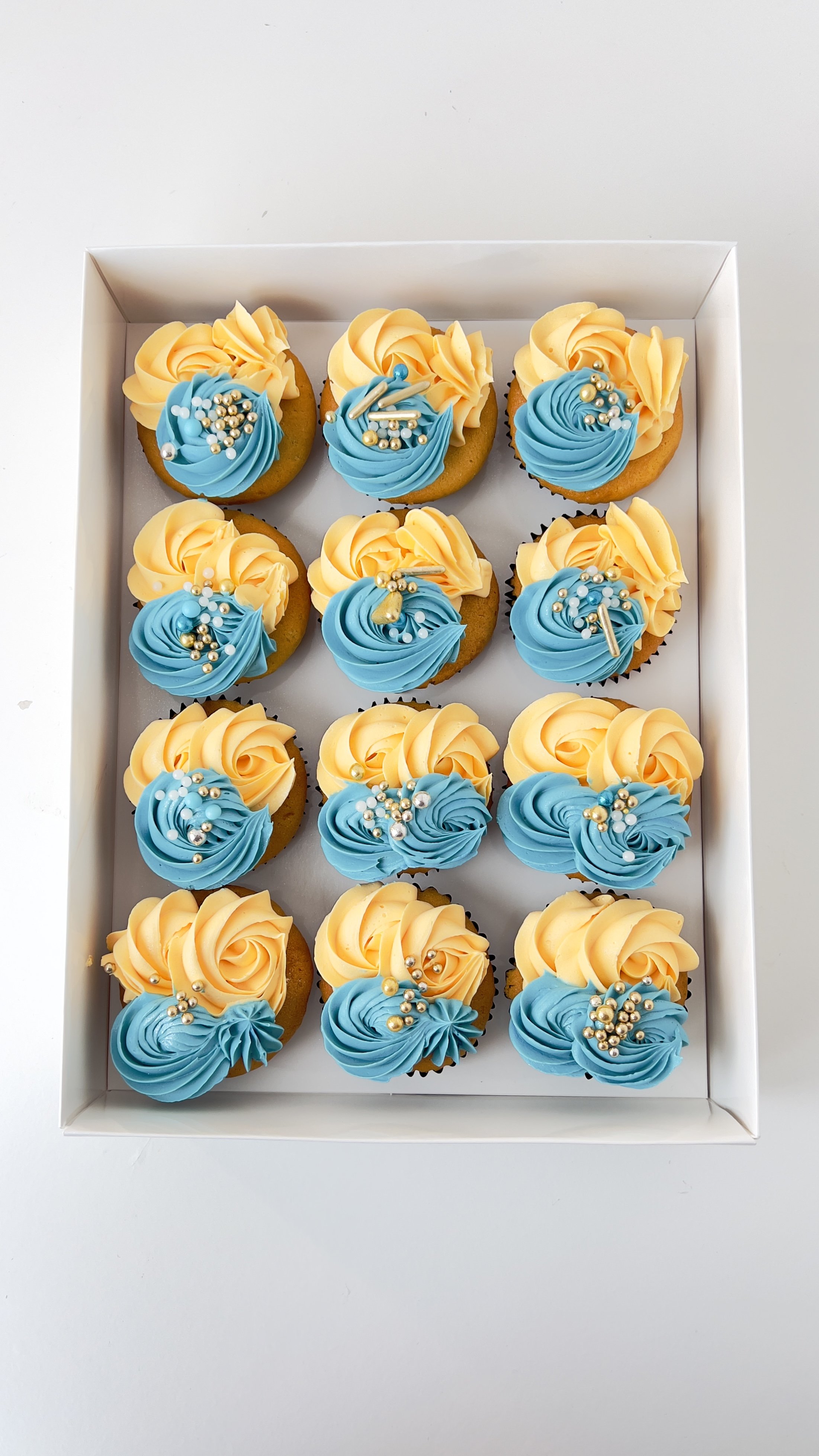 Box of 12 Teal and Cream Cupcakes by Sensational Cakes and Desserts.