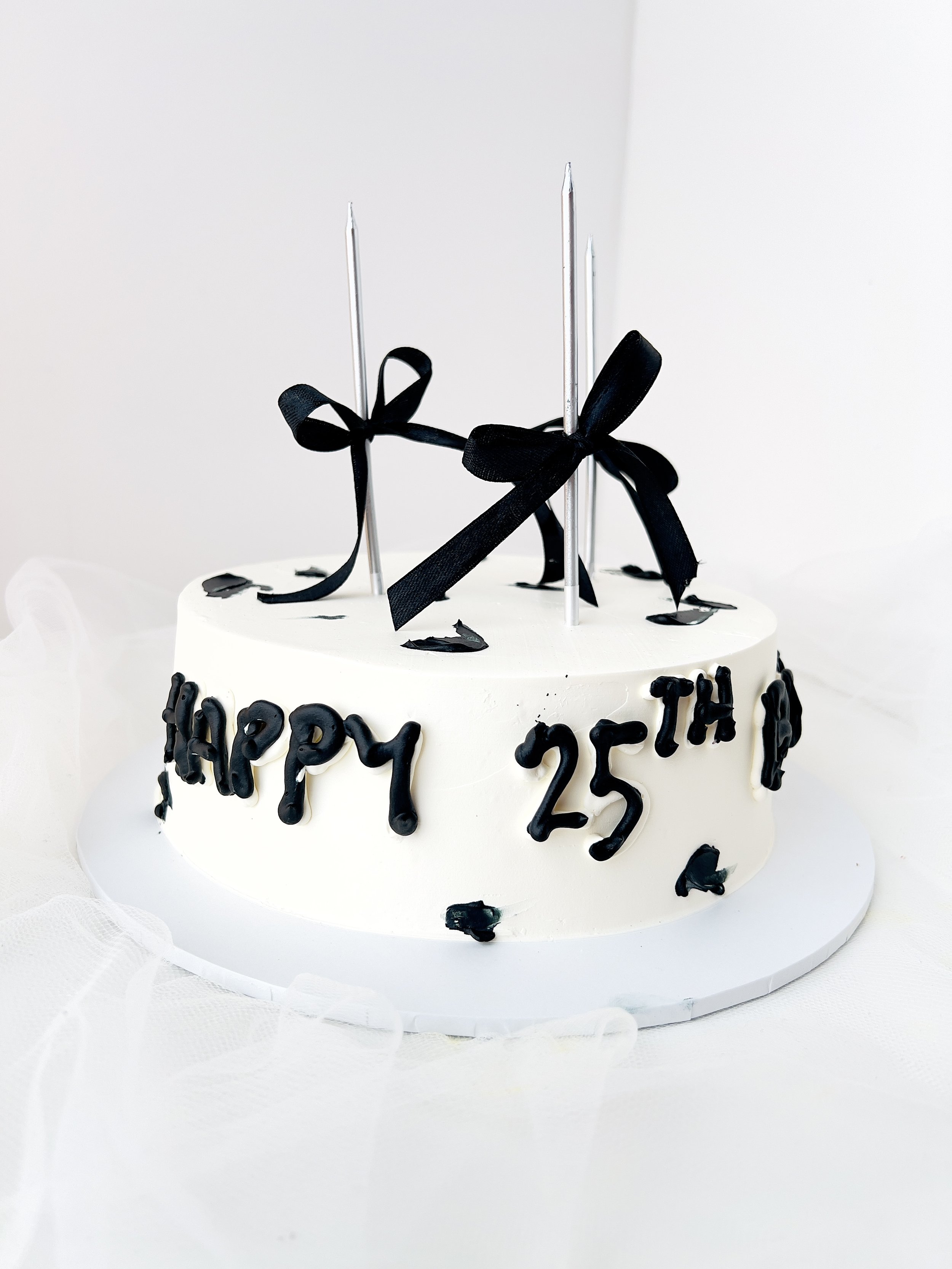 Black and White Single Layer Ribbon Cake by Sensational Cakes and Desserts.