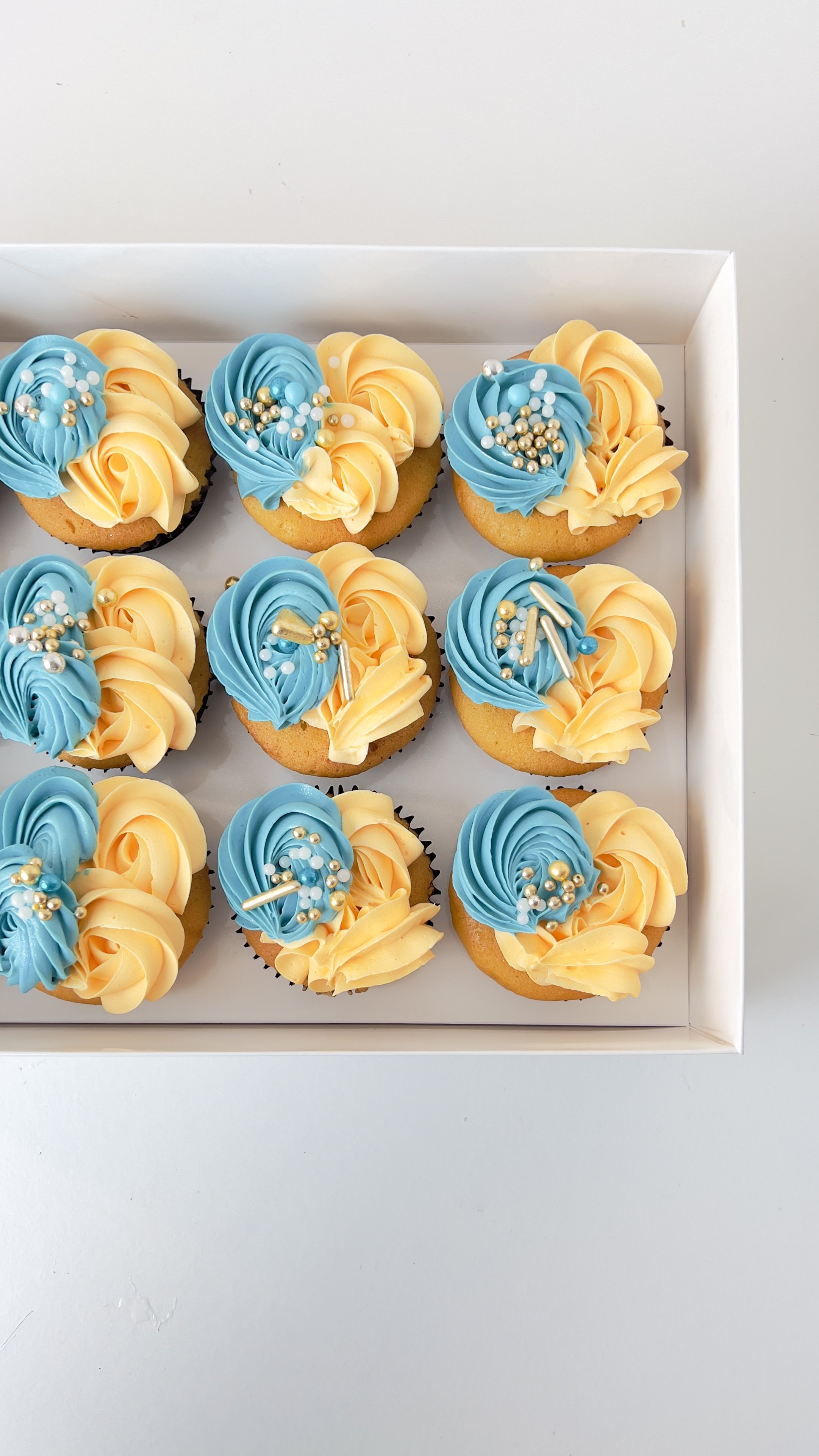 Box of 12 Teal and Cream Cupcakes by Sensational Cakes and Desserts.