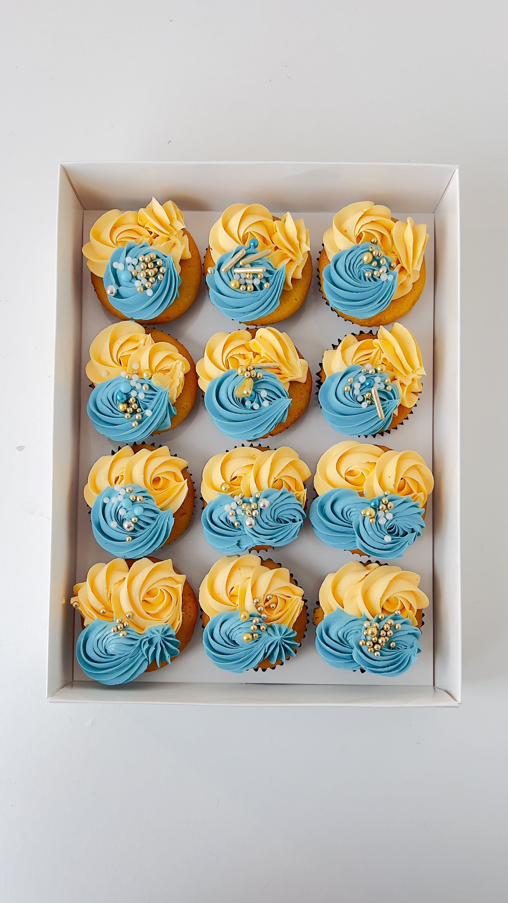 Box of 12 Teal and Cream Cupcakes by Sensational Cakes and Desserts.