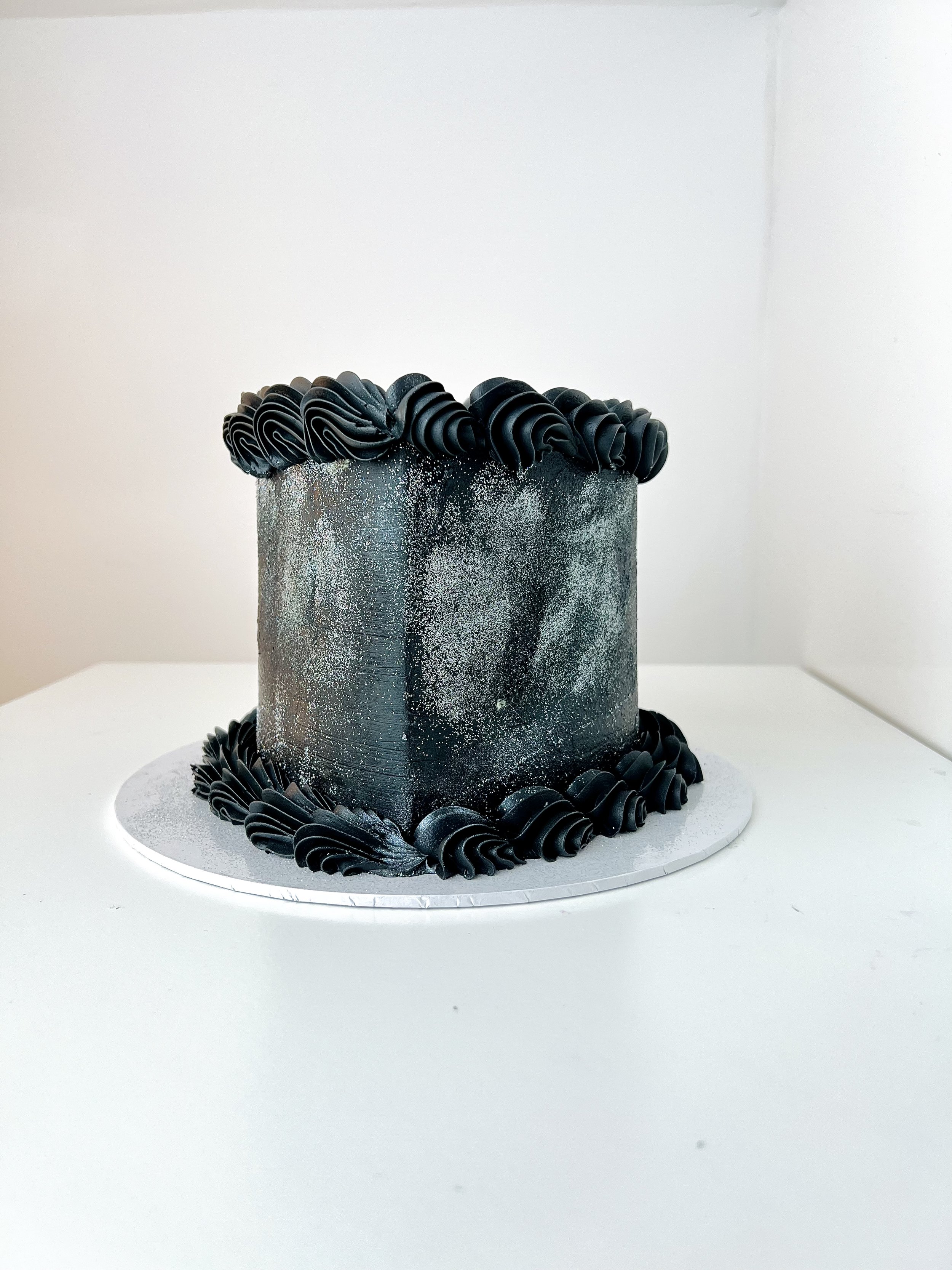 Front view of the Black Heart Cake with Glitter Finish by Sensational Cakes and Desserts