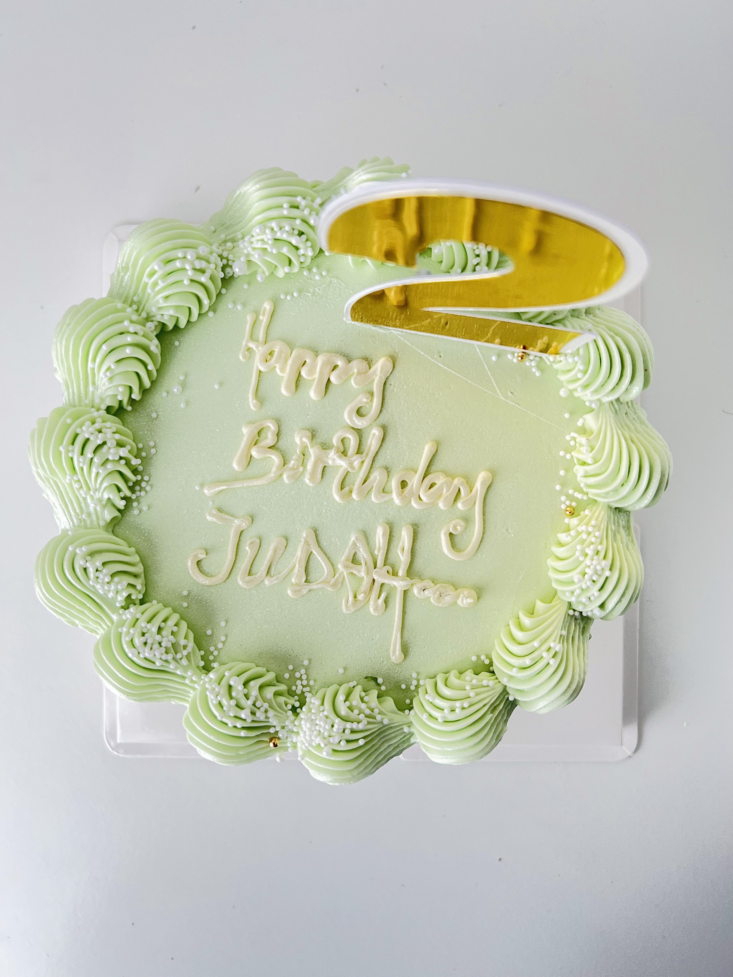 Top view of the Elegant Green Birthday Cake With Gold Number Topper by Sensational Cakes and Desserts