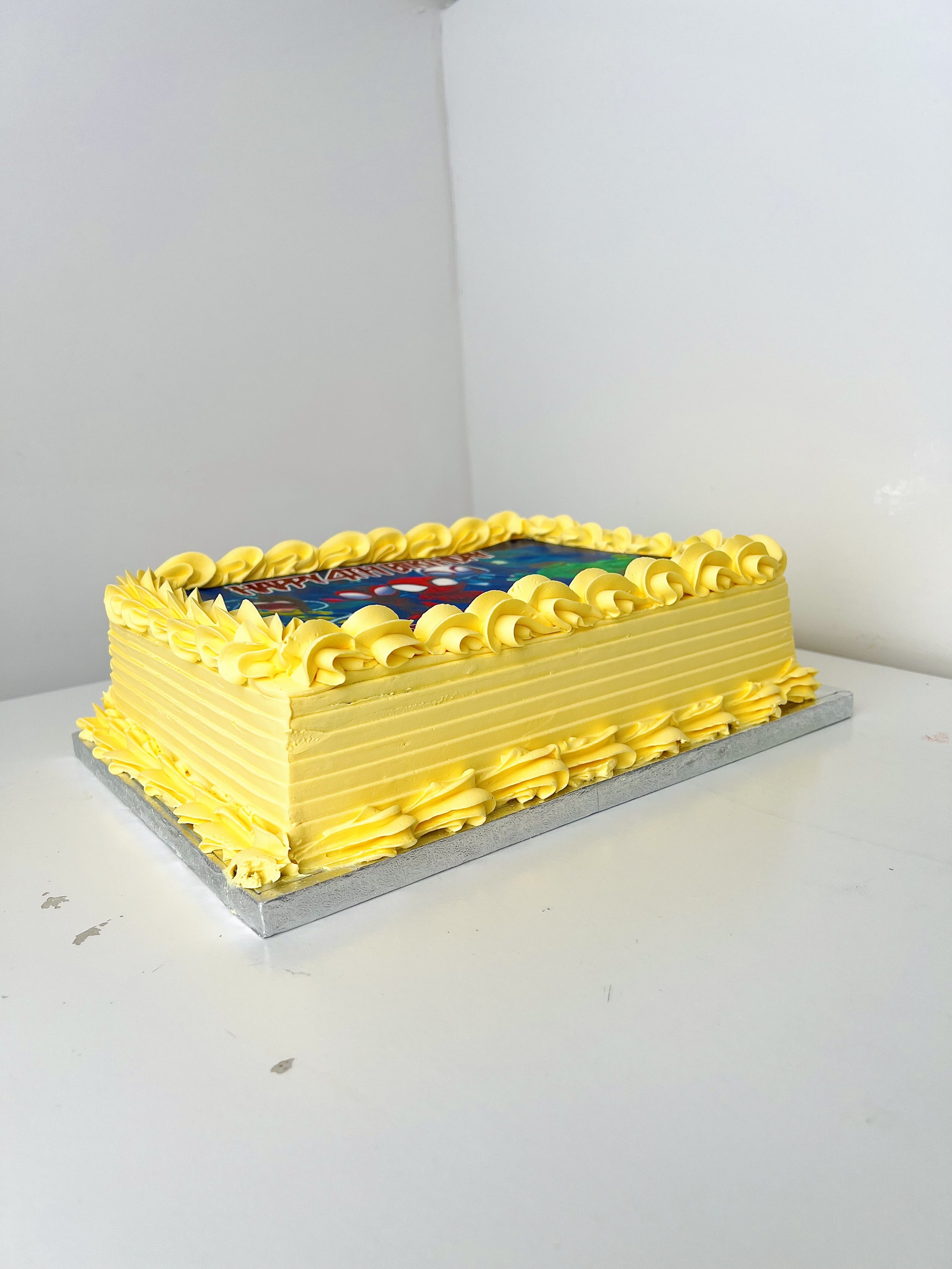 Right side view of the Spiderman Character Sheet Cake by Sensational Cakes and Desserts