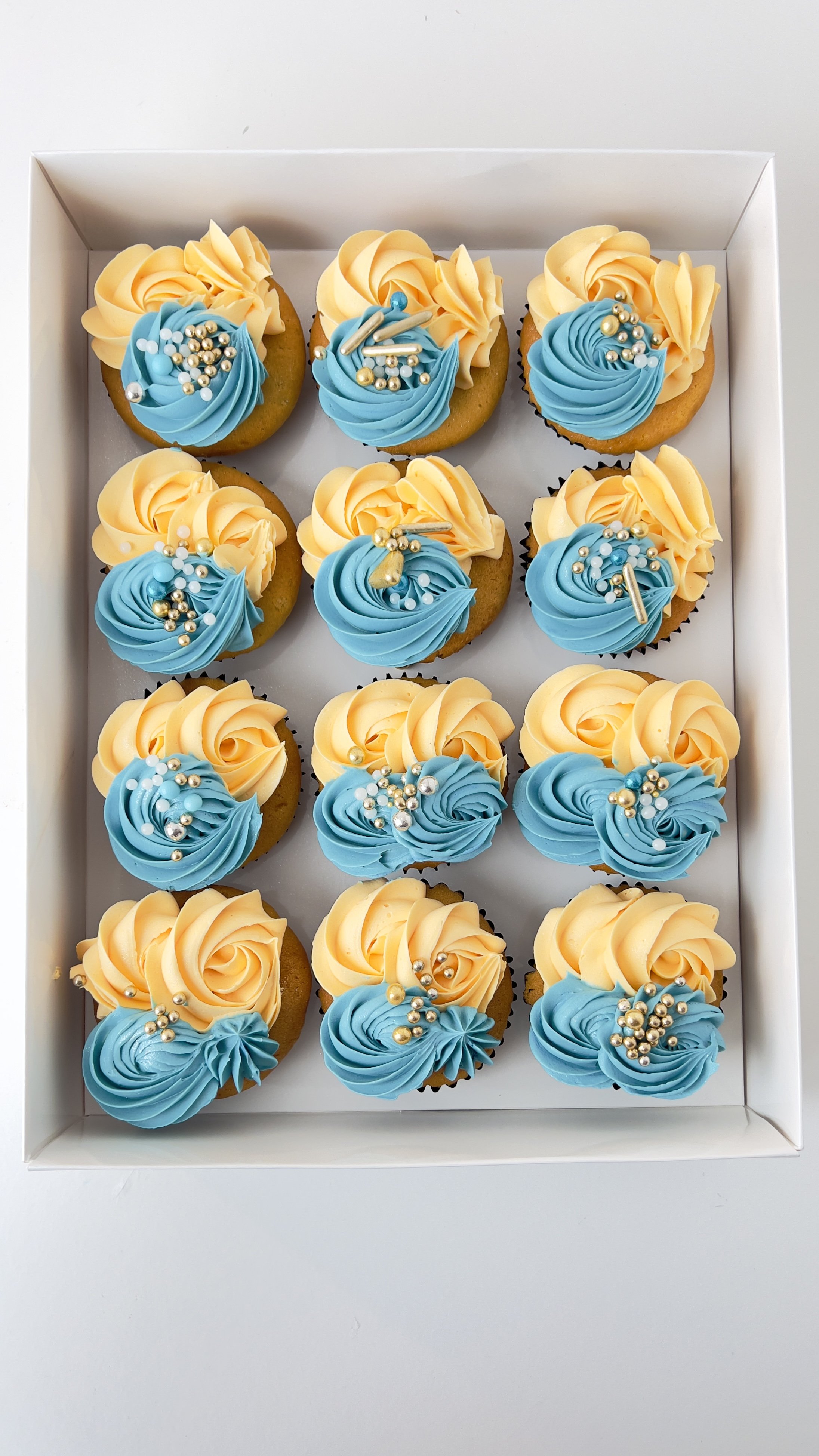 Box of 12 Teal and Cream Cupcakes by Sensational Cakes and Desserts.