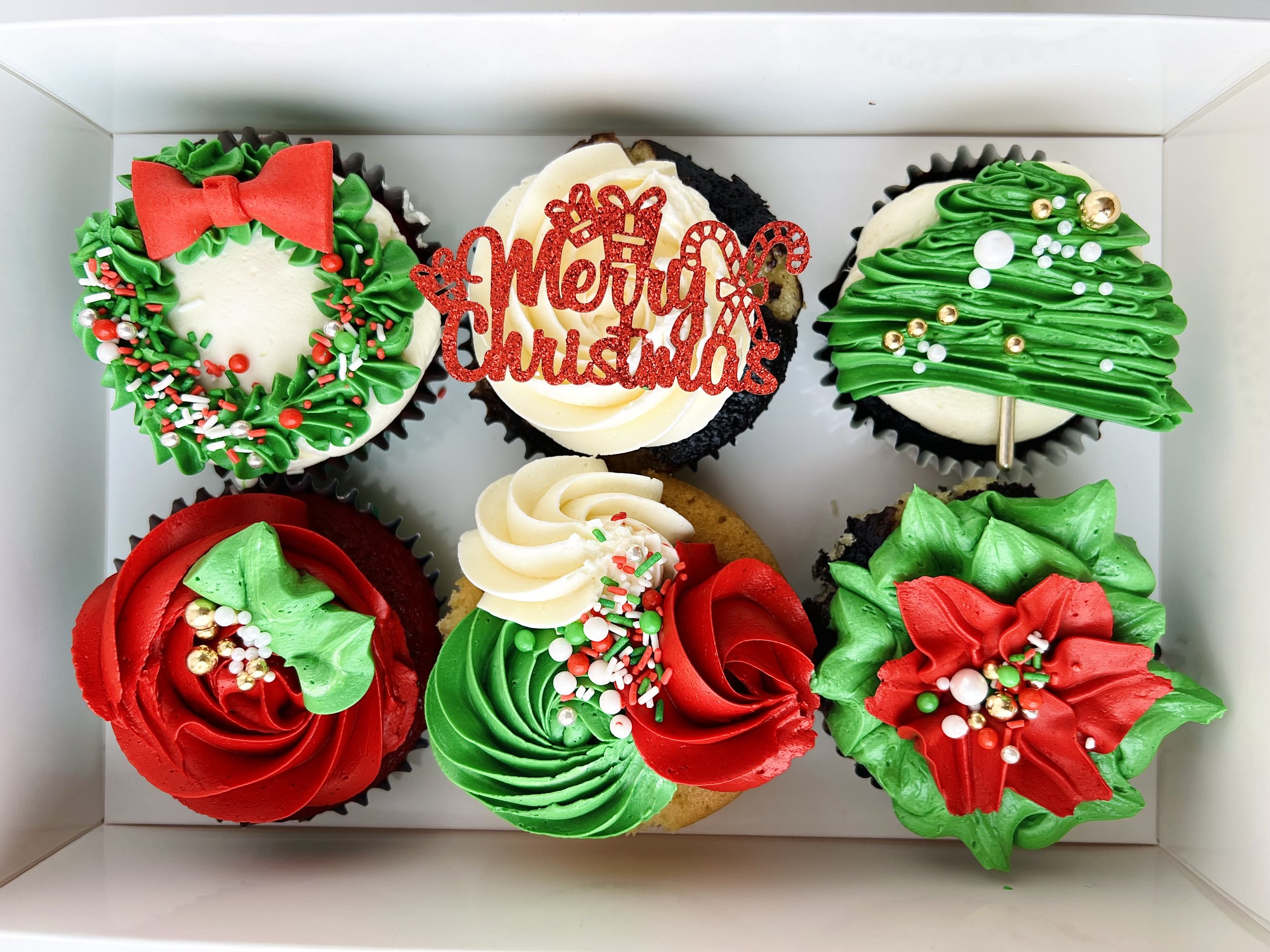 A box of 6 of Luxury Christmas Cupcakes by Sensational Cakes and Desserts.