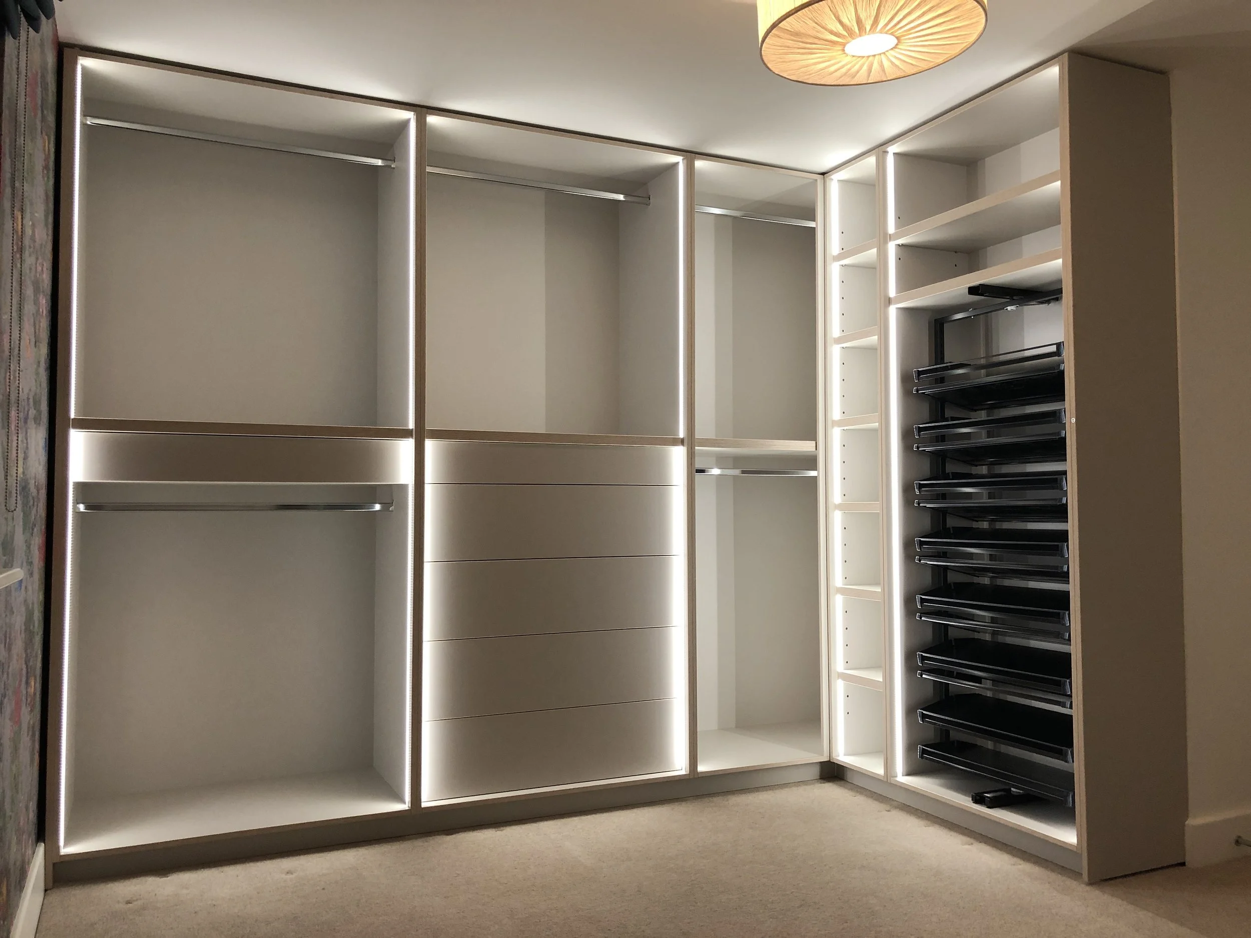 Open wardrobe in corner of the room