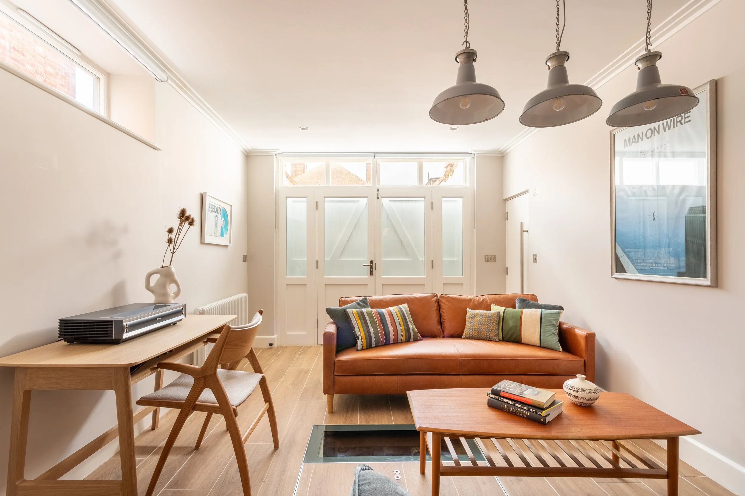 Coach House Studio- leather sofa and industrial lights14.jpg