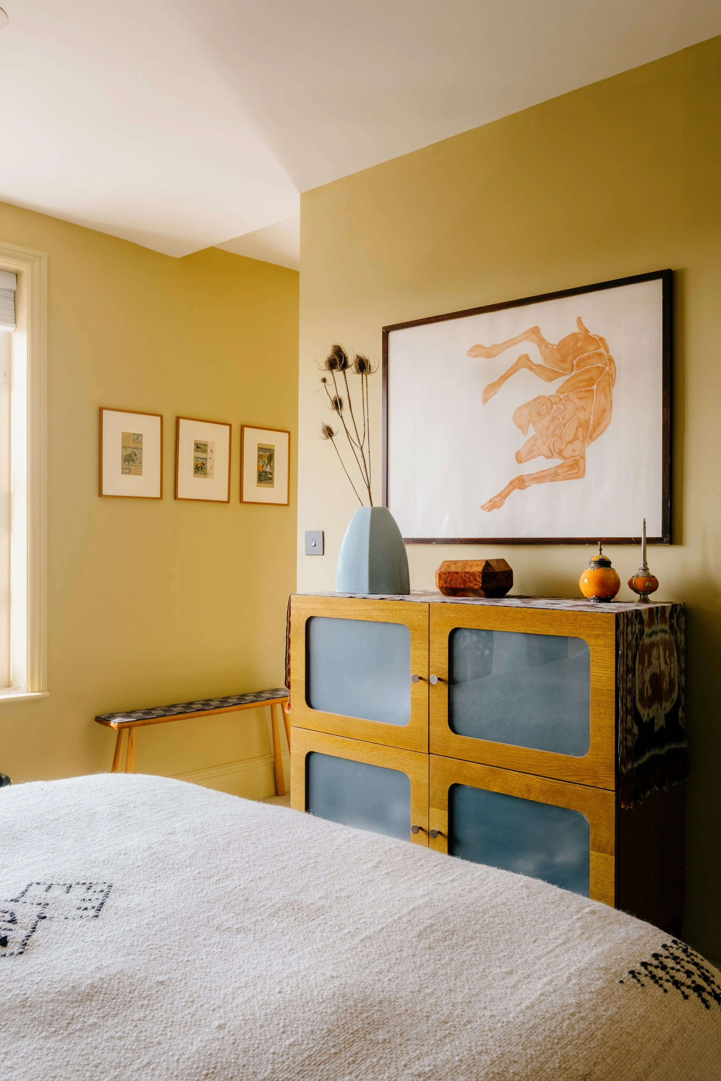 Bedroom with art on walls copy.jpg