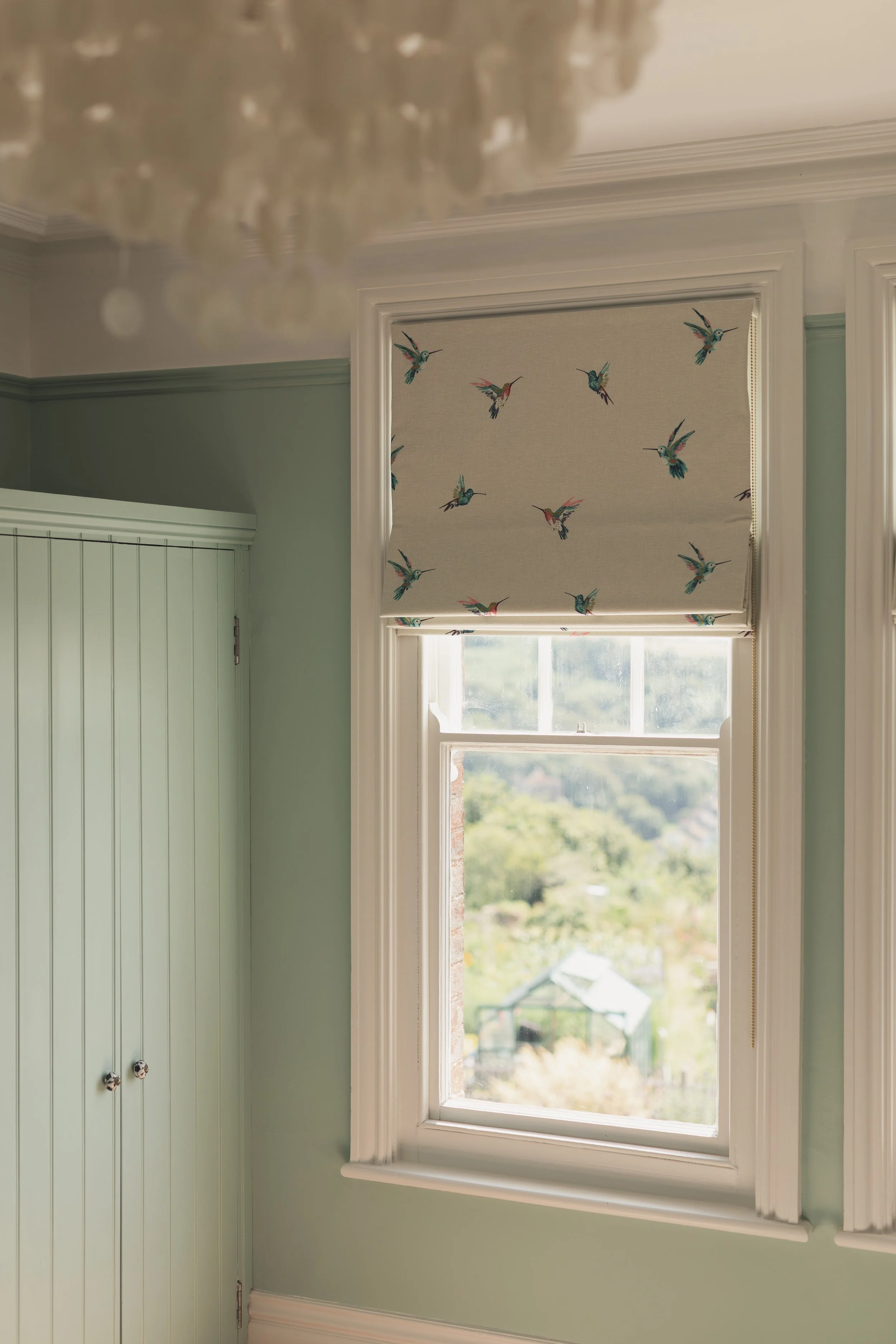 Roman blinds with bird motif.jpg
