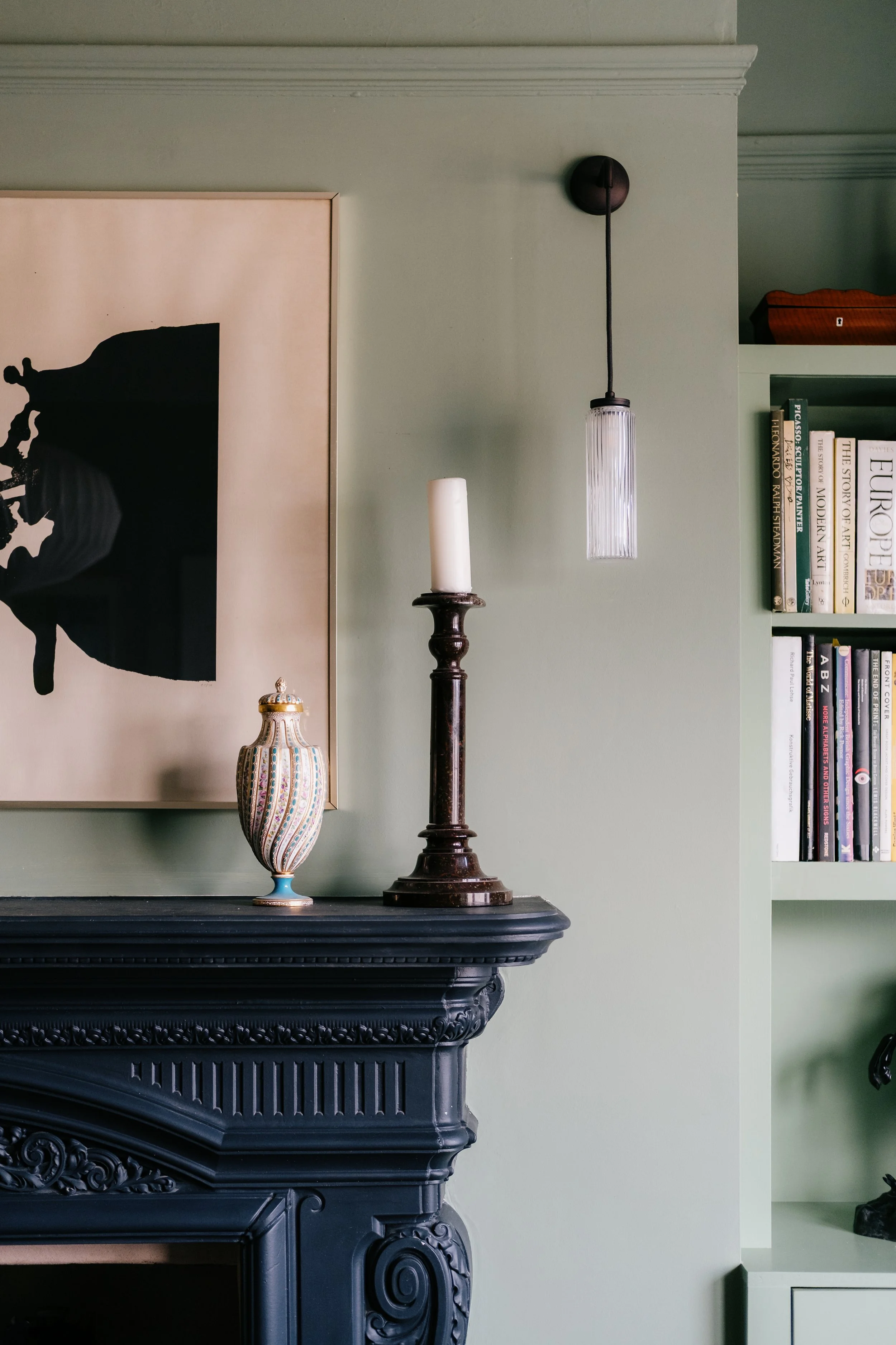 Detail of fireplace with candle and wall light copy.jpg