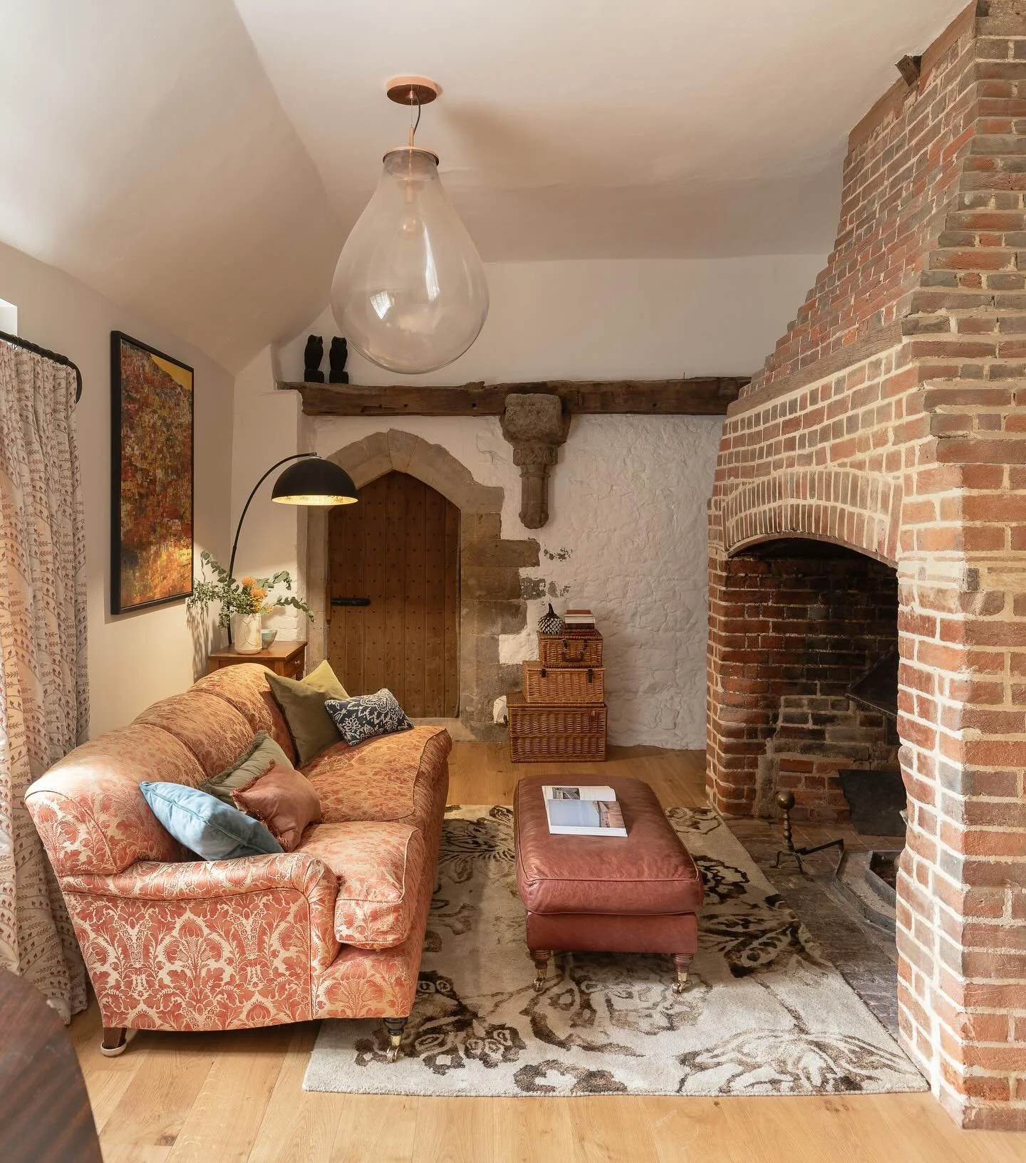 COSY CORNER &bull; So - this fireplace is older than the rest of the 18th century Manor House but has a special place as it is situated in the middle of the building. 

Restoring the brickwork needed a specialist craftsman and had to take out old cem
