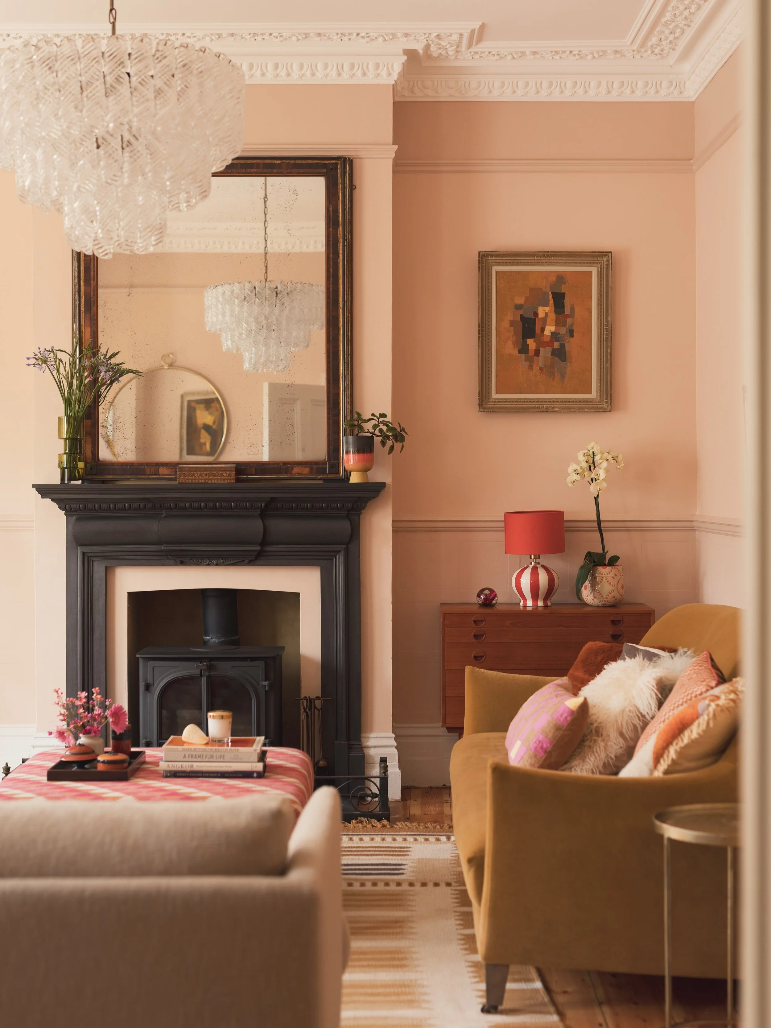 EDWARDIAN TOWNHOUSE &bull; Warm pink sun-kissed sitting room. 

The evening sun in this room is like a big sunset hug. Everything in this space says something about the home owner. From the variety of textures - velvet, sheepskin, wool, to the warmth