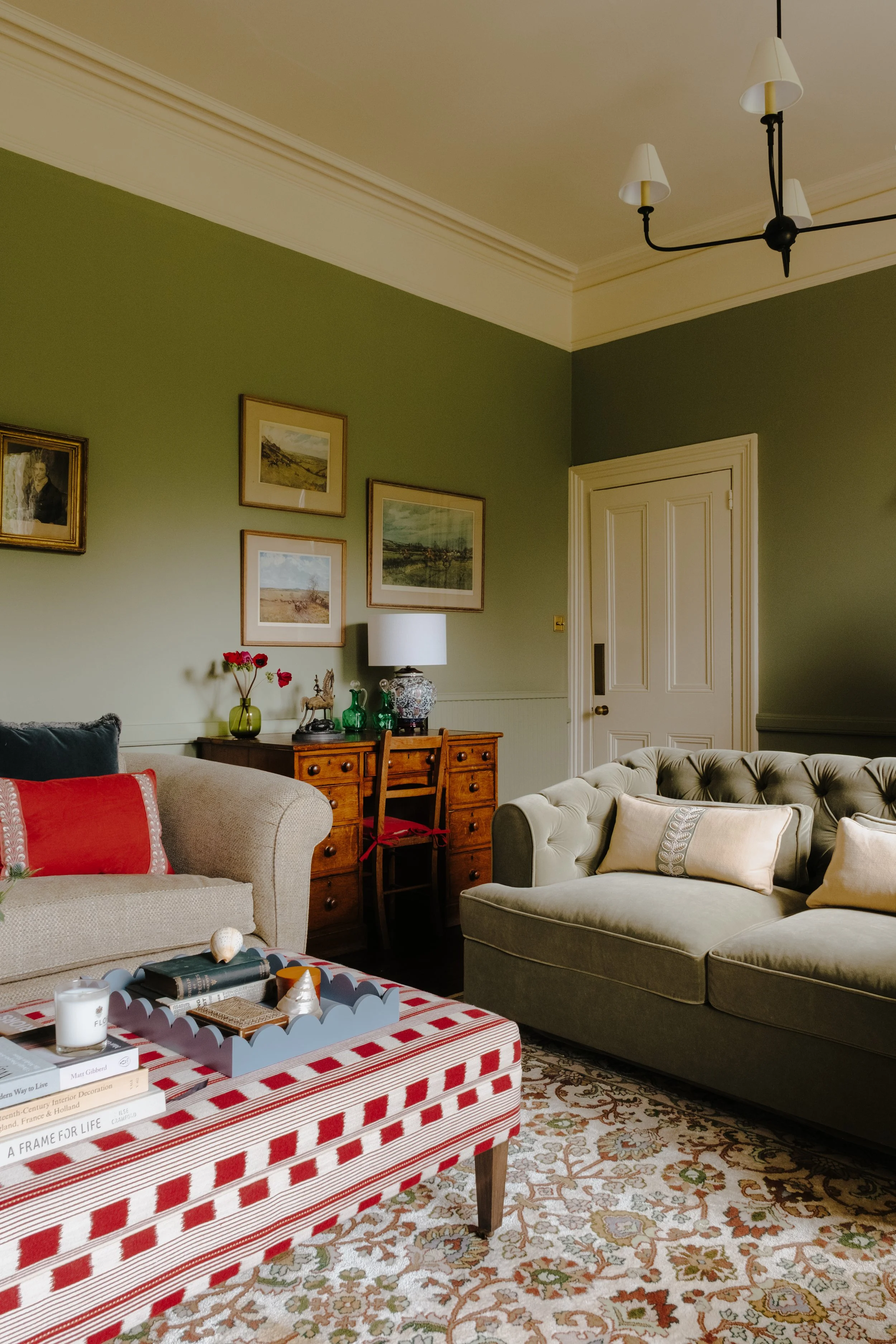 High ceiling family room, with design led ceiling lights.