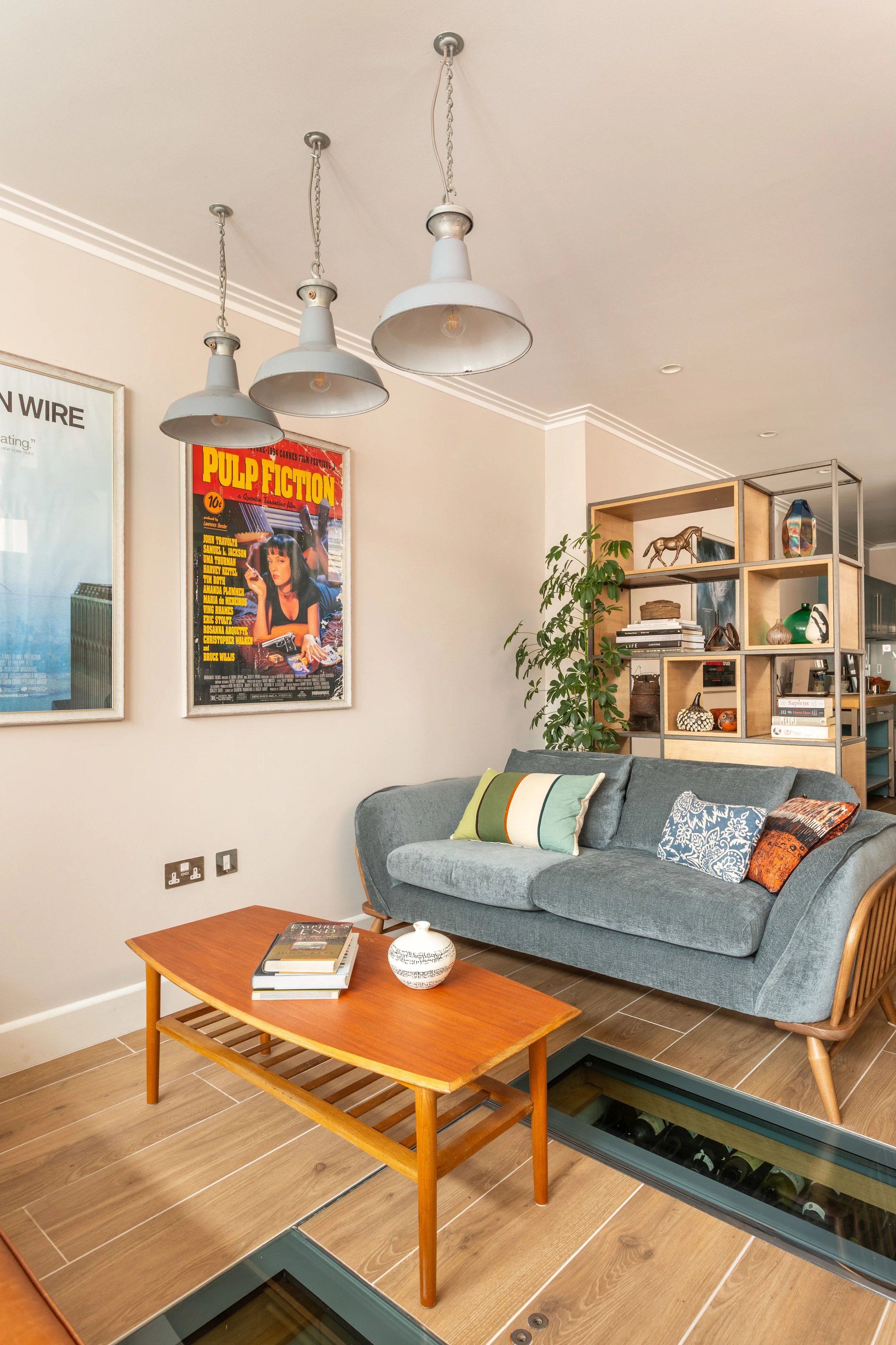 Studio with velvet sofa, room divider and film posters-2.jpg