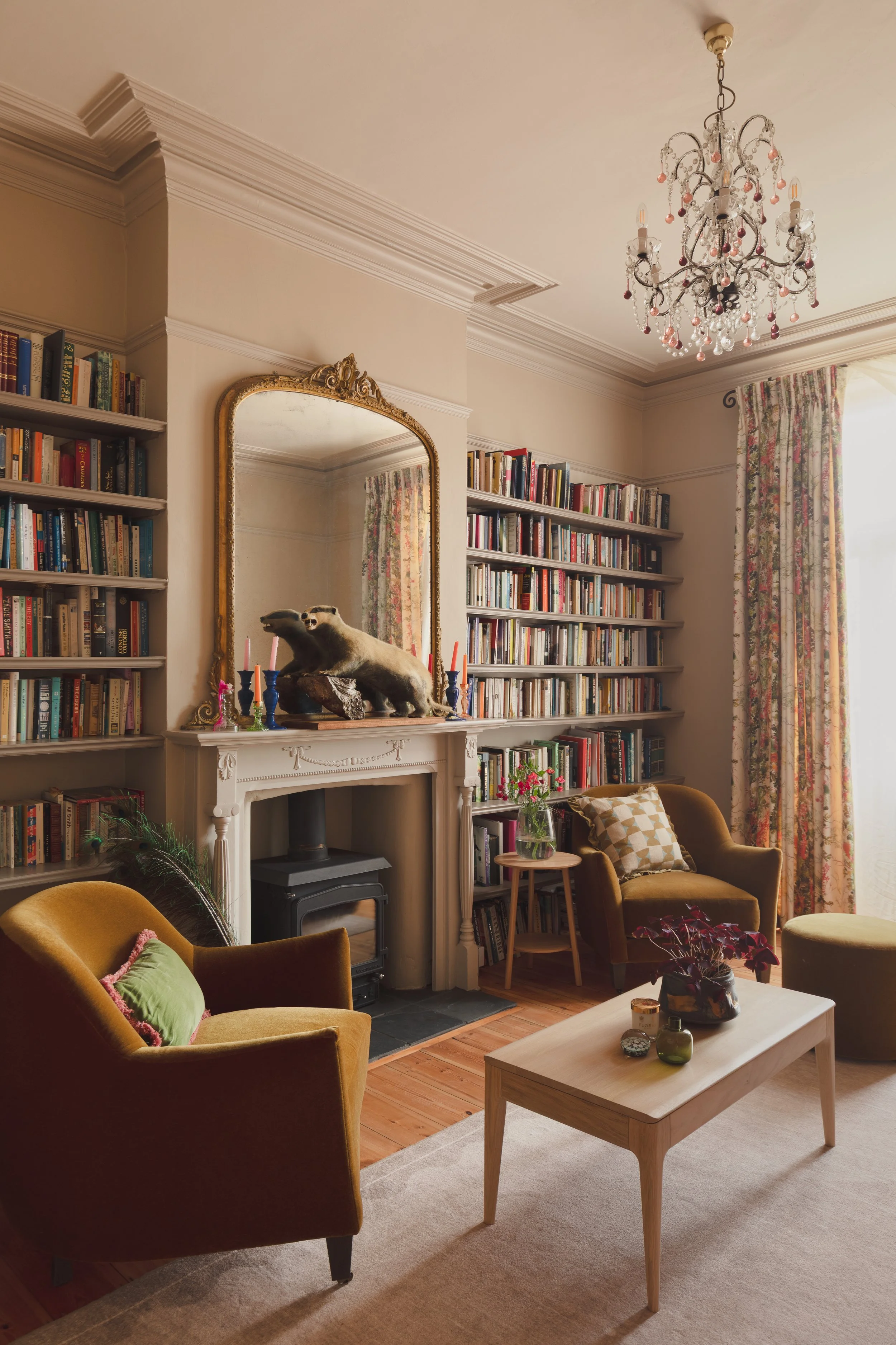 Victorian library with velvet chairs and bookcases.jpg