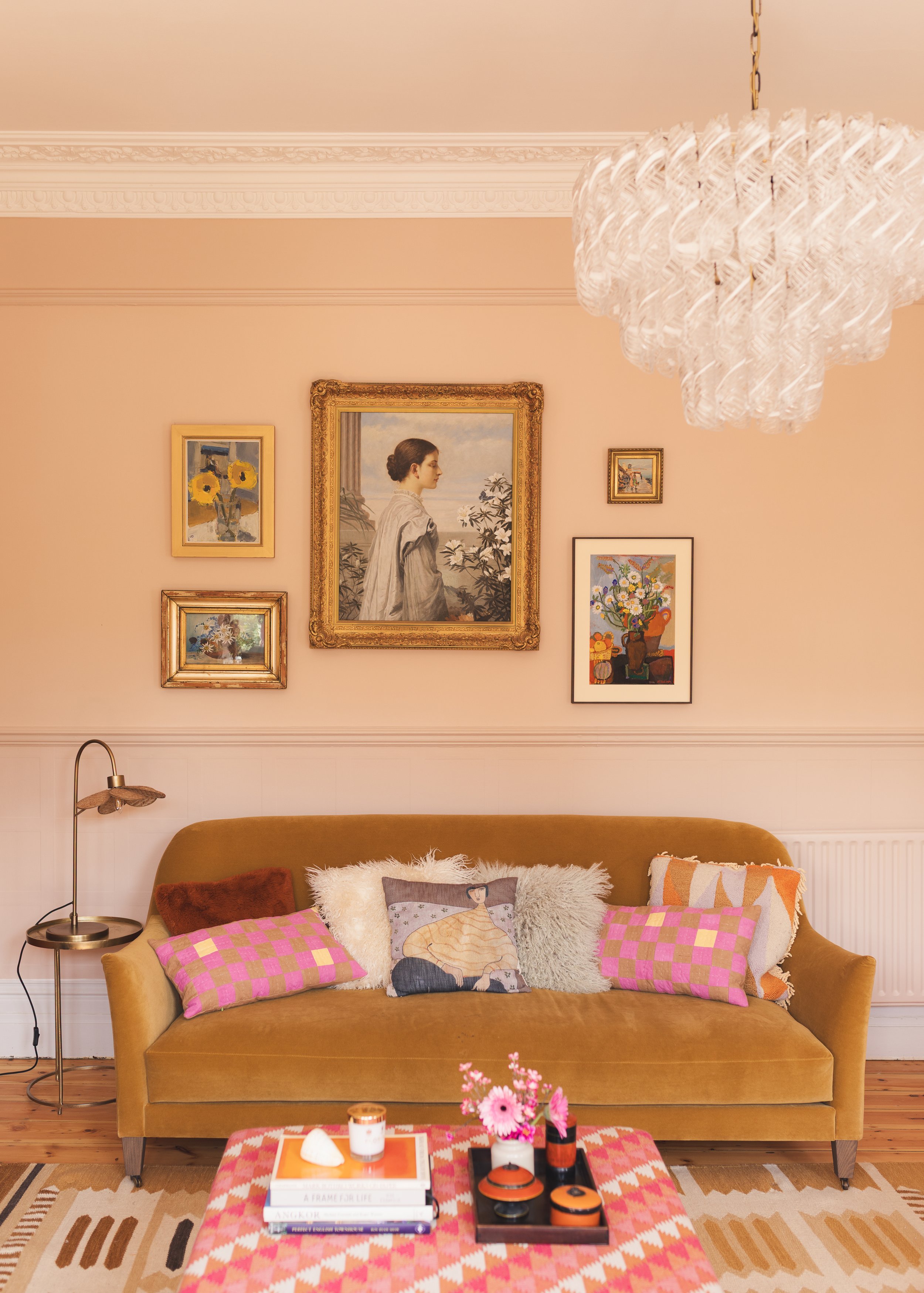 Pink sitting room with velvet sofa and art wall .jpg