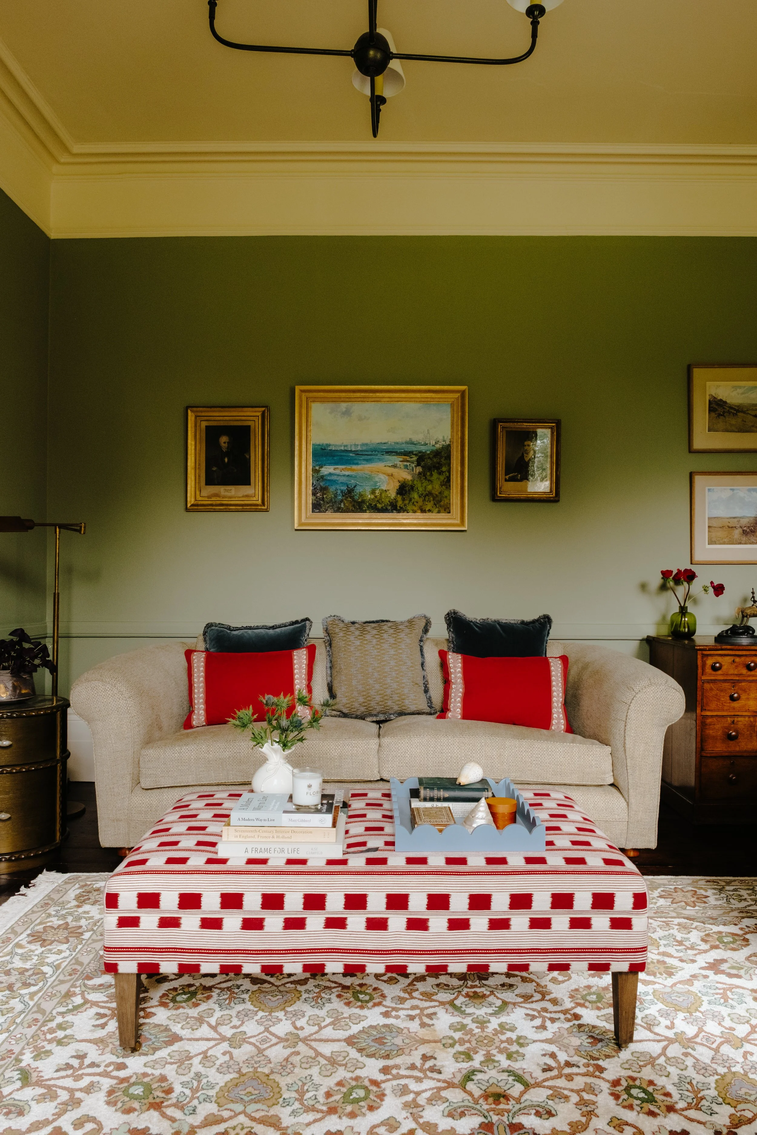 Georgian reception room with green sofa and check ottoman.jpg