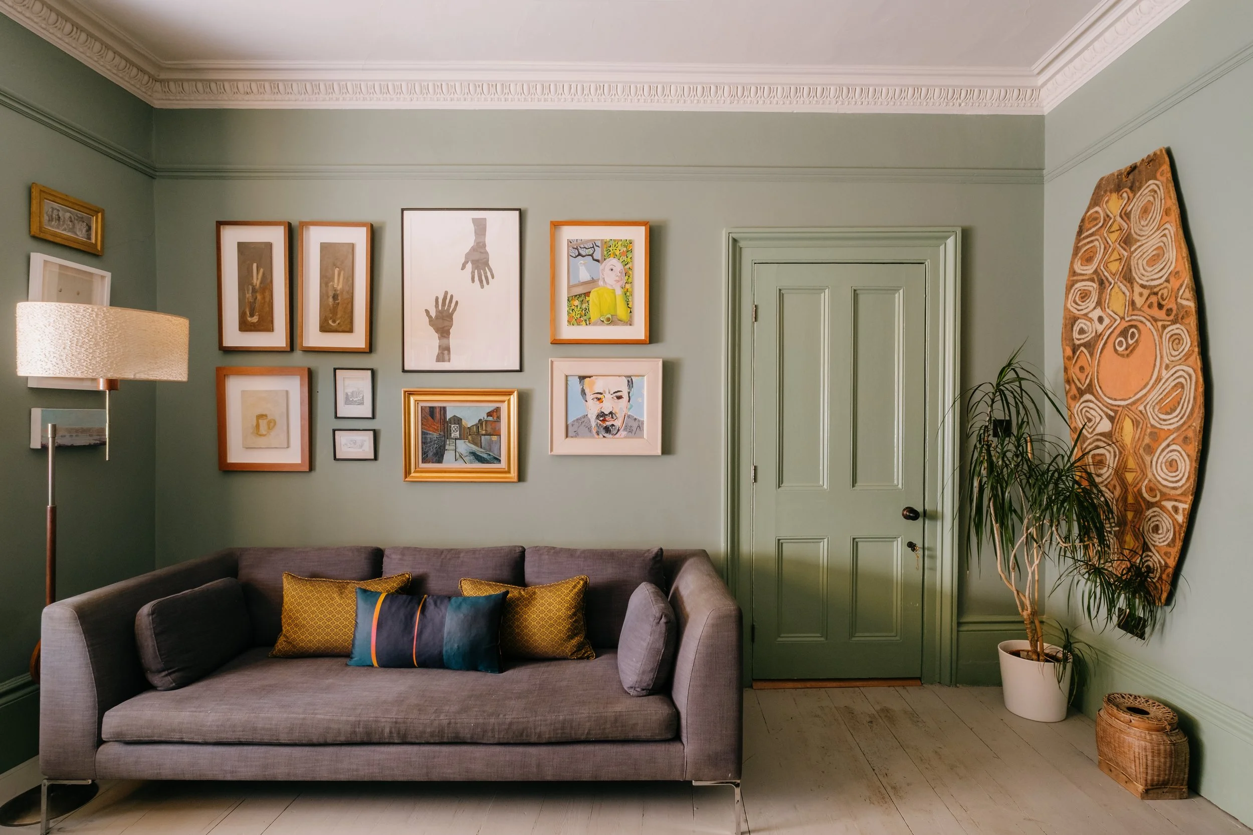 Green sitting room with art wall above sofa copy.jpg