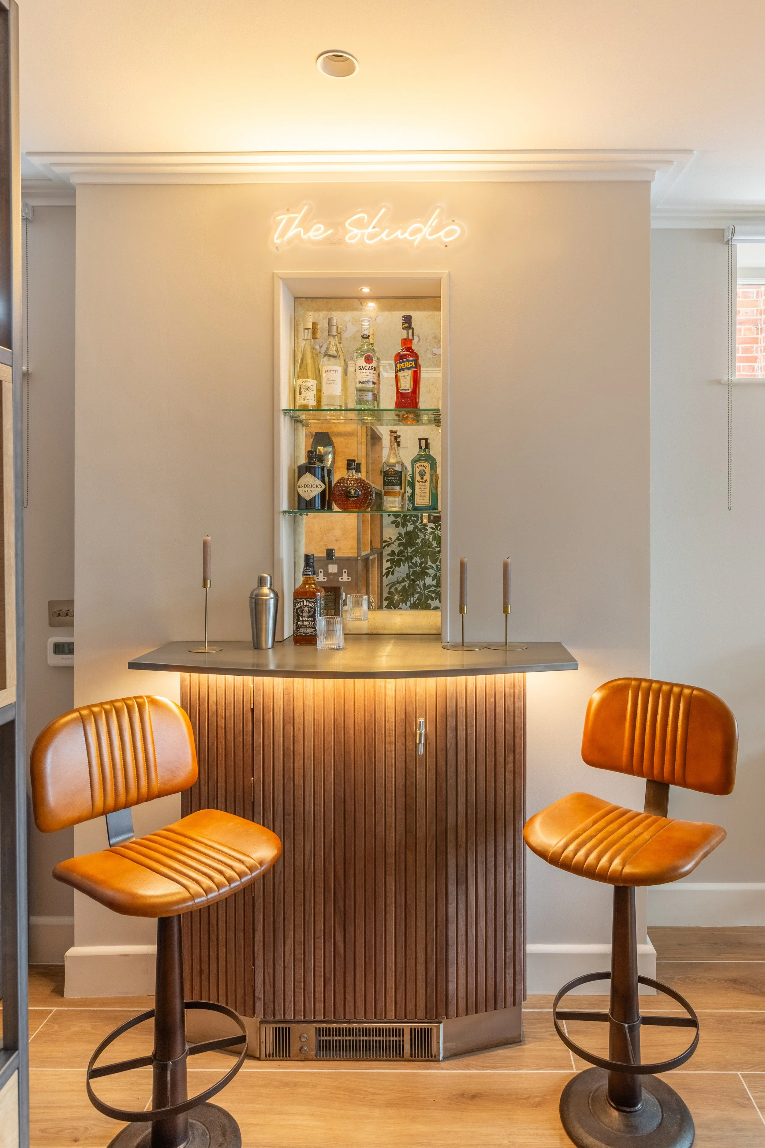 Bar with antique mirror, leather stools and nwon sign-5.jpg