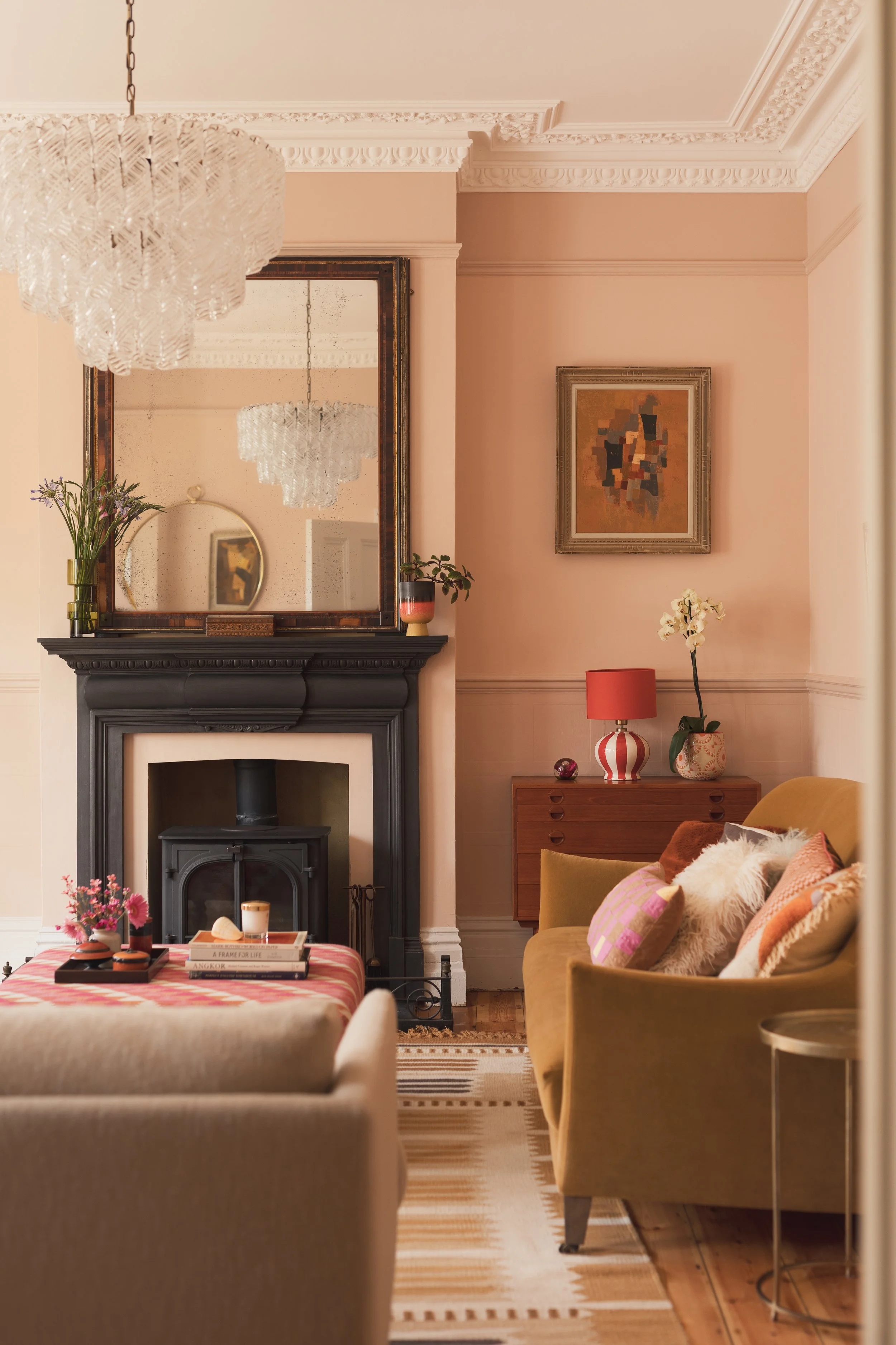 Pink sitting room with velvet sofas and ottoman.jpg