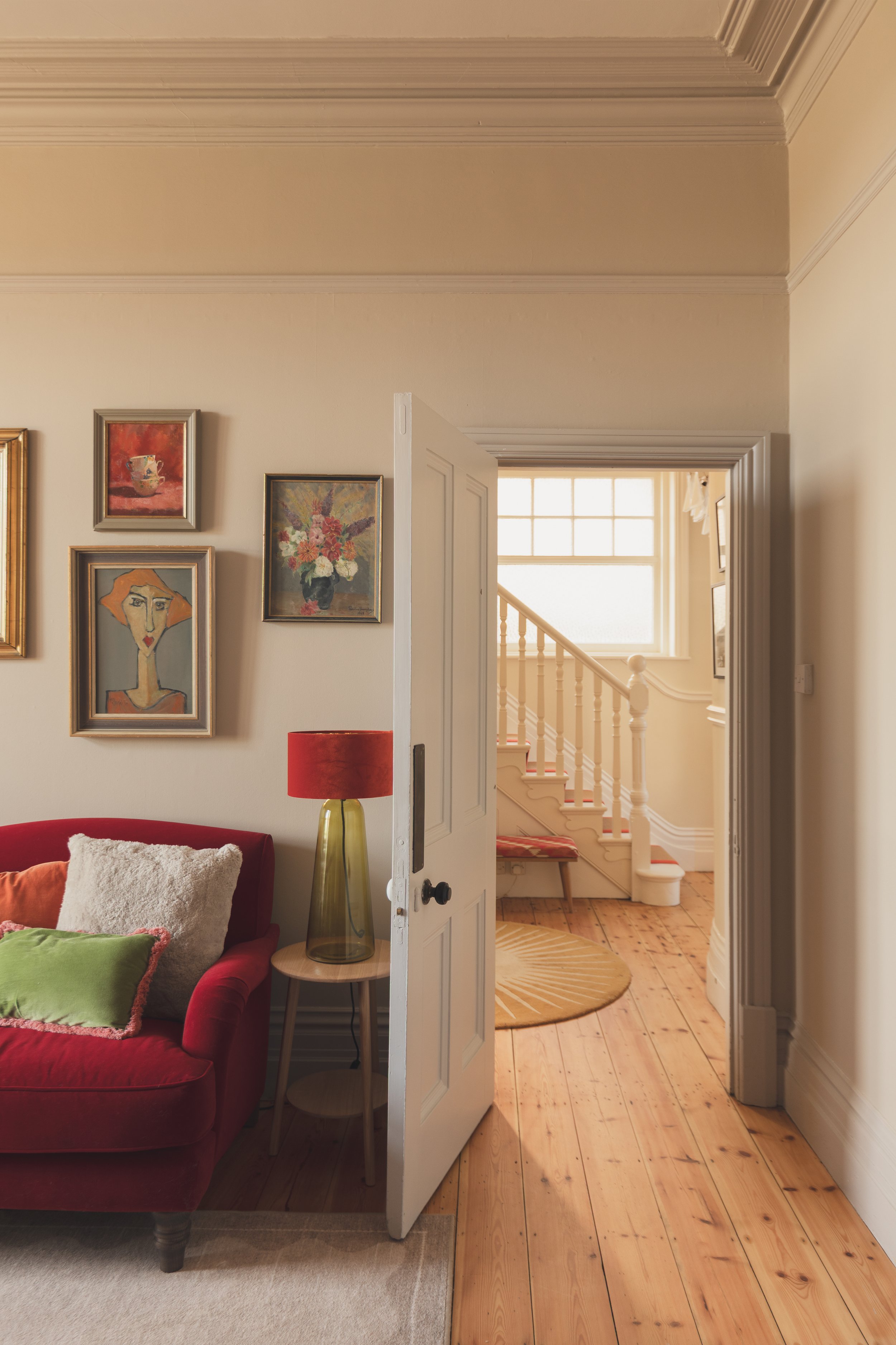 Sitting room with view to hall and staircase.jpg