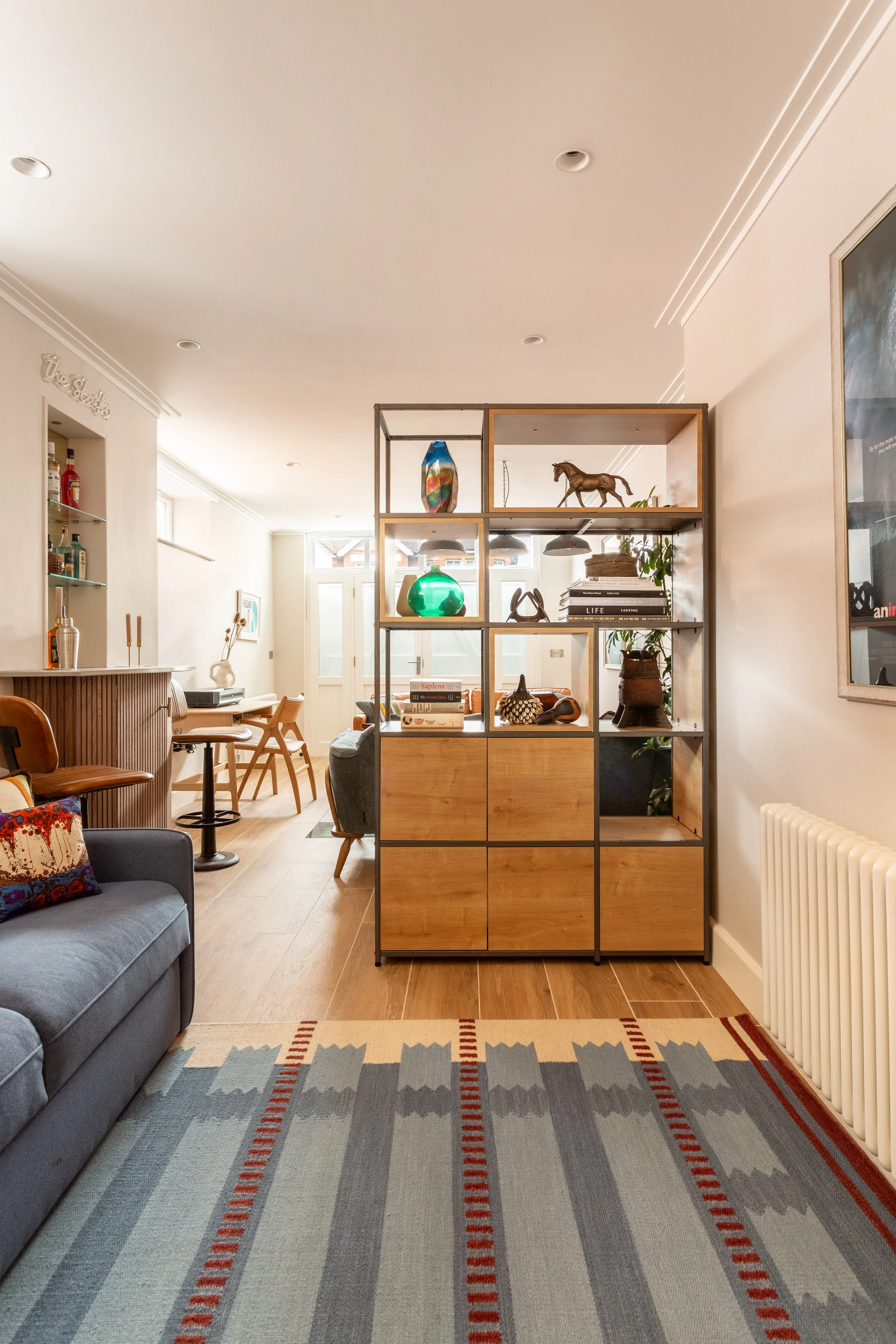 room divider with blue stripe rug.jpg