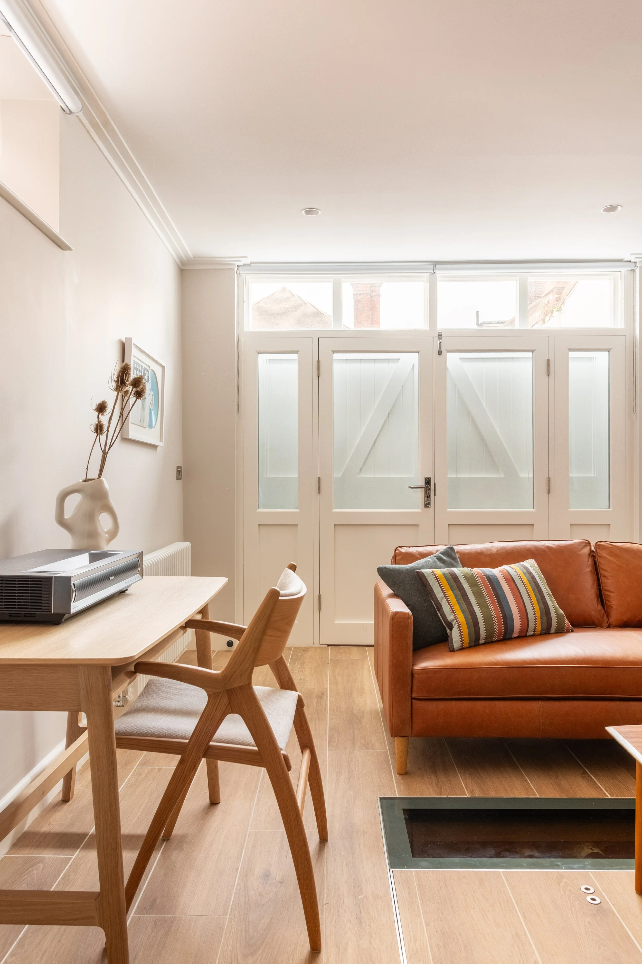 Coach House Studio- with desk and leather sofa15.jpg