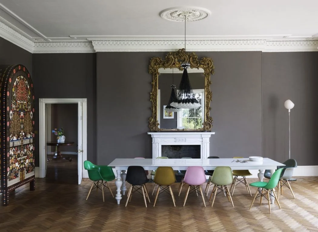 Chairs in bright colours around a table